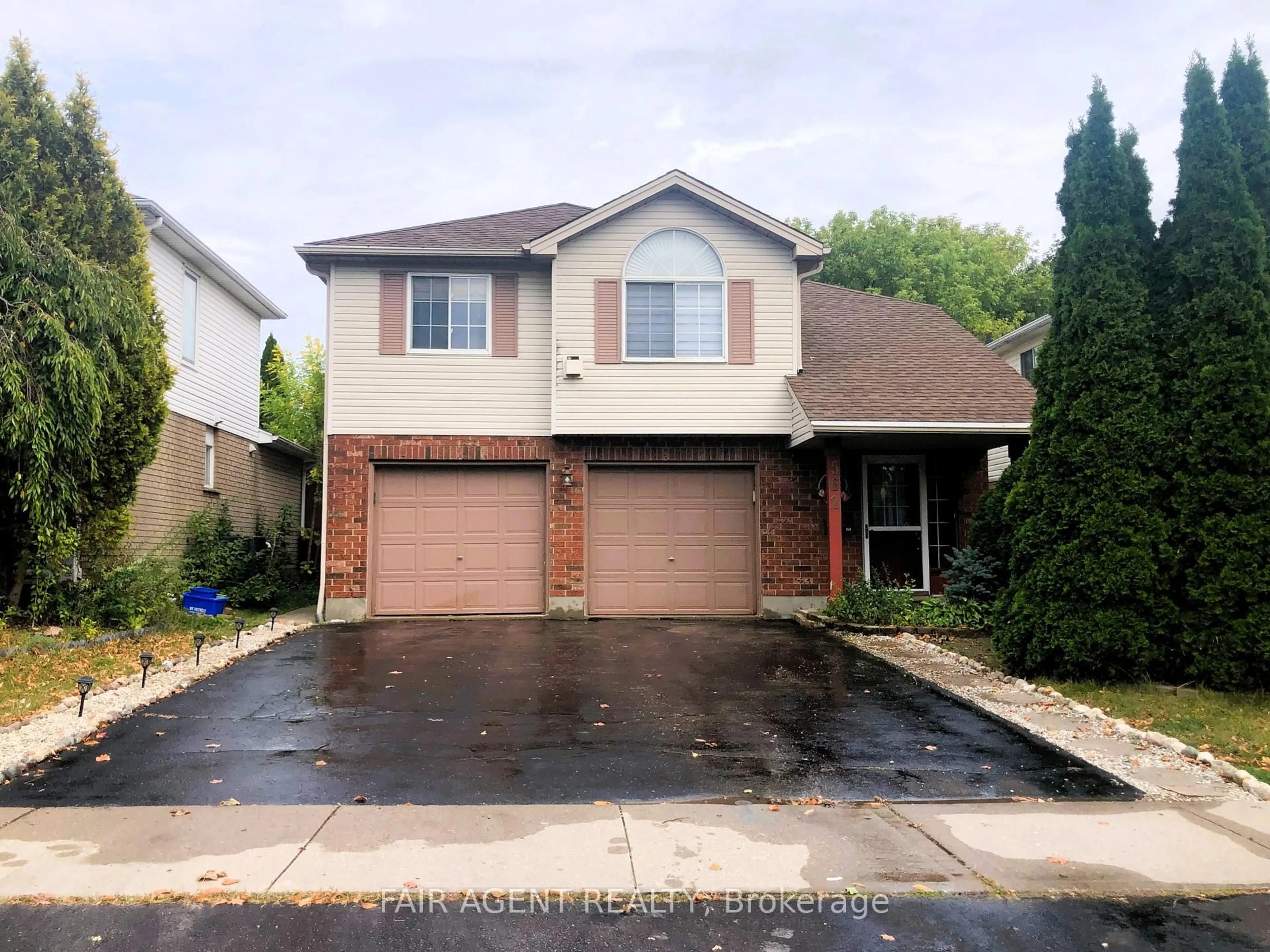 Home with brick exterior material, street for 562 Erinbrook Dr, Kitchener Ontario N2E 3M8