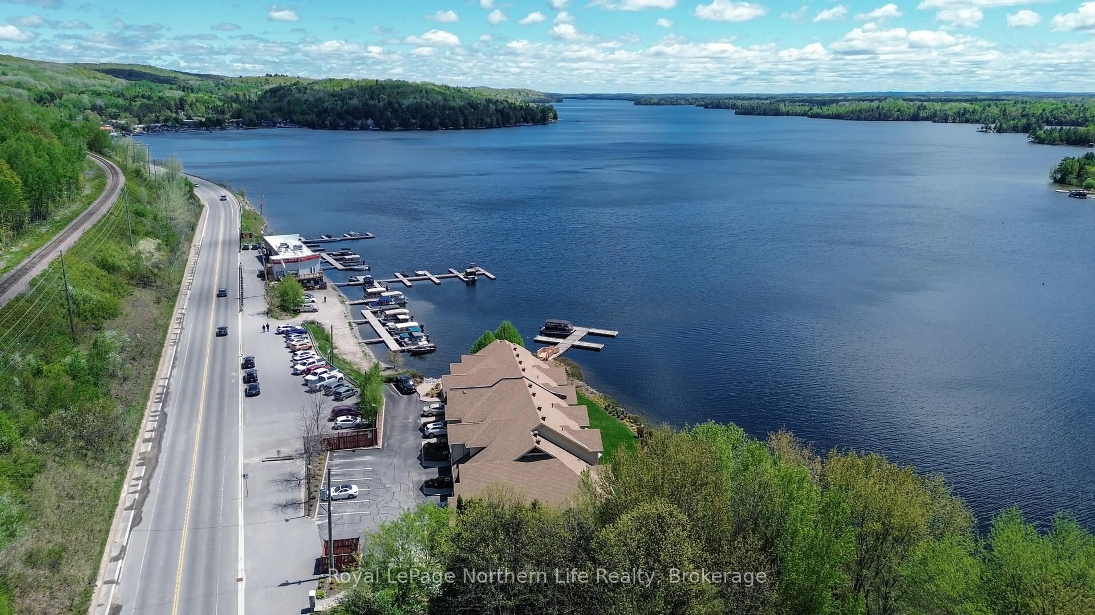 A pic from outside/outdoor area/front of a property/back of a property/a pic from drone, water/lake/river/ocean view for 3477 Trout Lake Rd #6, North Bay Ontario P1A 0B4