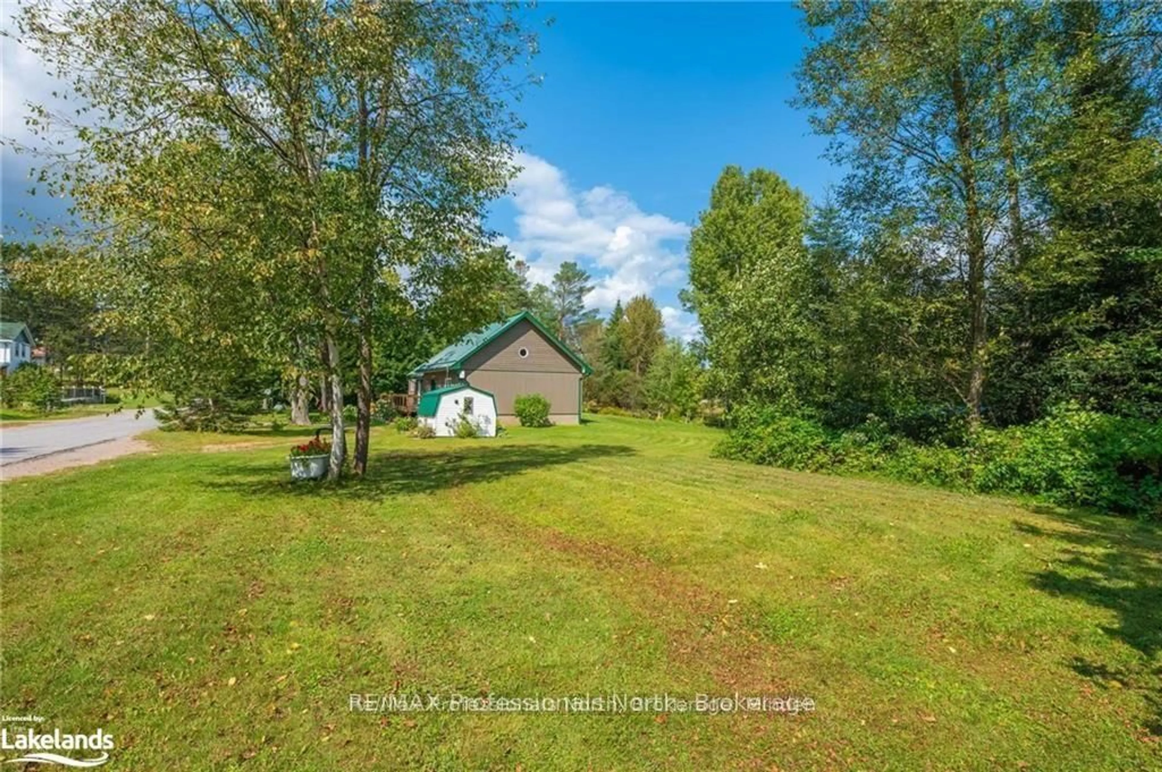 A pic from outside/outdoor area/front of a property/back of a property/a pic from drone, water/lake/river/ocean view for 1026 Dewey St, Highlands East Ontario K0M 2K0