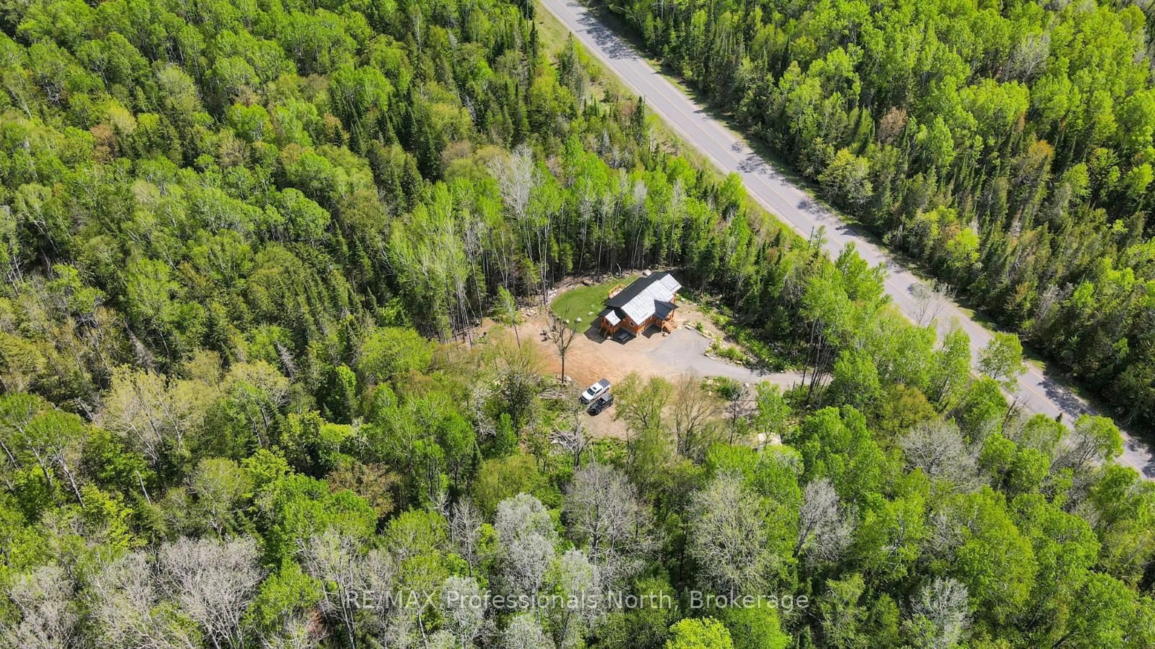 A pic from outside/outdoor area/front of a property/back of a property/a pic from drone, forest/trees view for 6587 Elephant Lake Rd, Dysart et al Ontario K0L 1X0