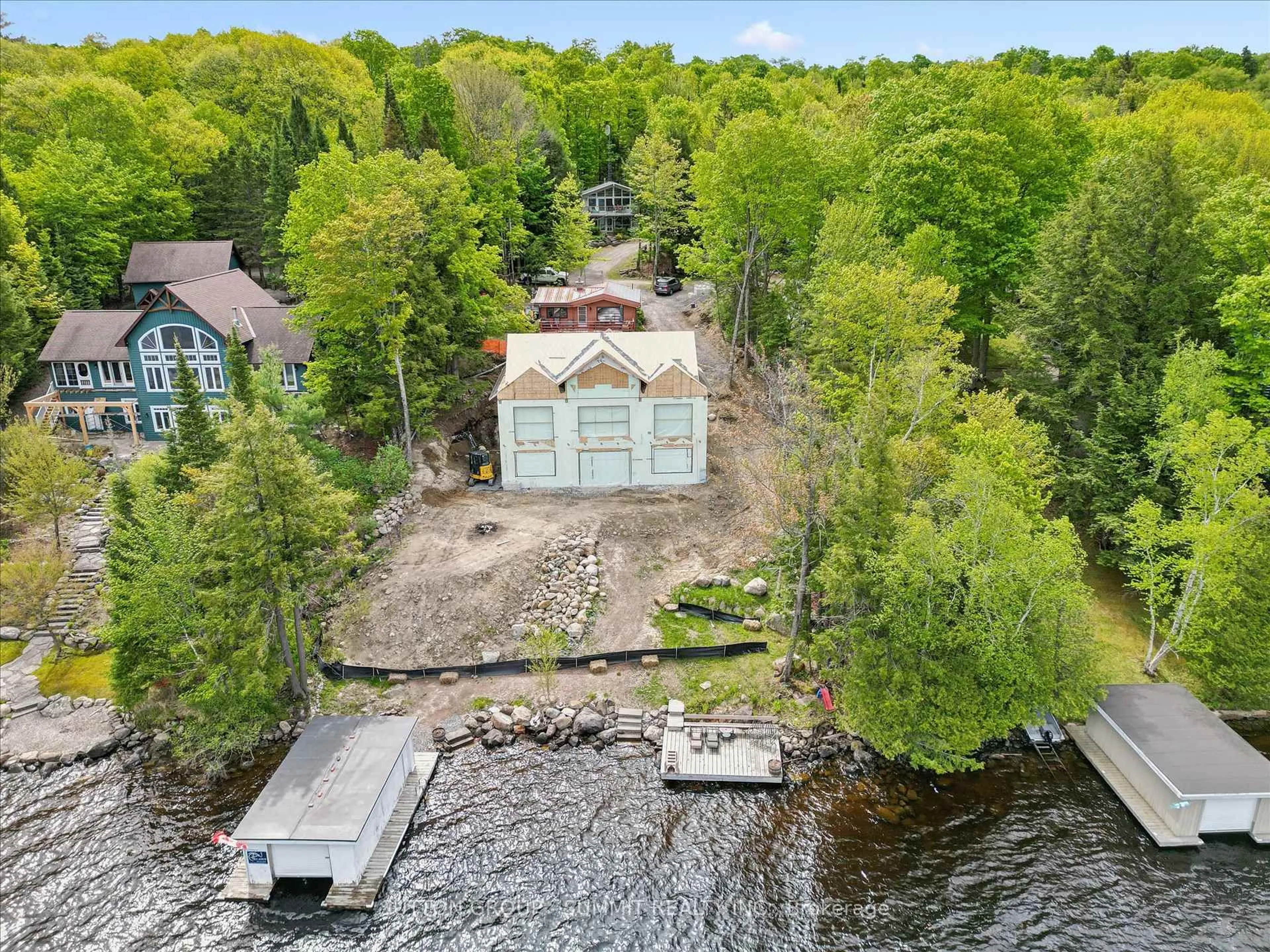 A pic from outside/outdoor area/front of a property/back of a property/a pic from drone, water/lake/river/ocean view for 227 HOOD Rd, Huntsville Ontario P1H 2J3