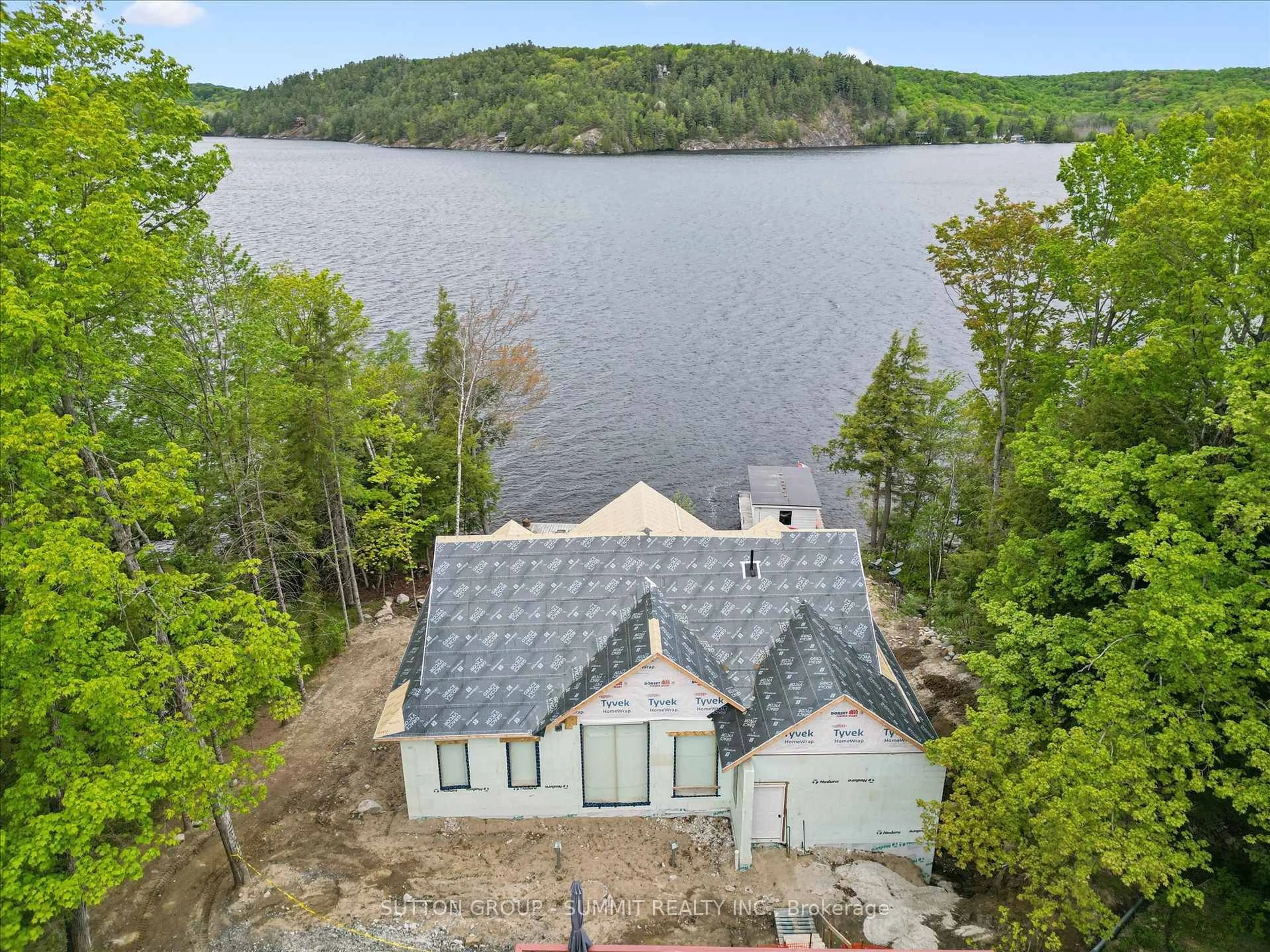 A pic from outside/outdoor area/front of a property/back of a property/a pic from drone, water/lake/river/ocean view for 227 HOOD Rd, Huntsville Ontario P1H 2J3