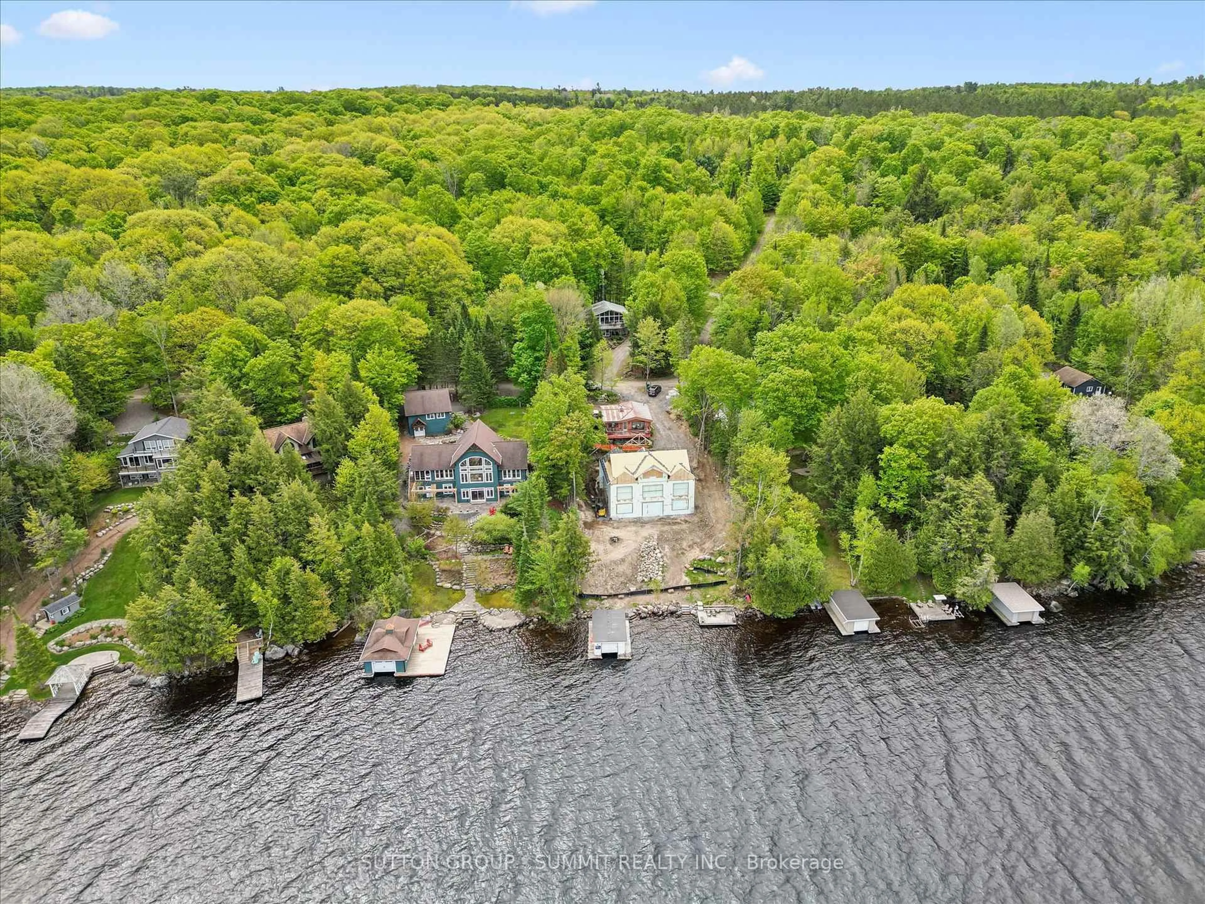 A pic from outside/outdoor area/front of a property/back of a property/a pic from drone, water/lake/river/ocean view for 227 HOOD Rd, Huntsville Ontario P1H 2J3