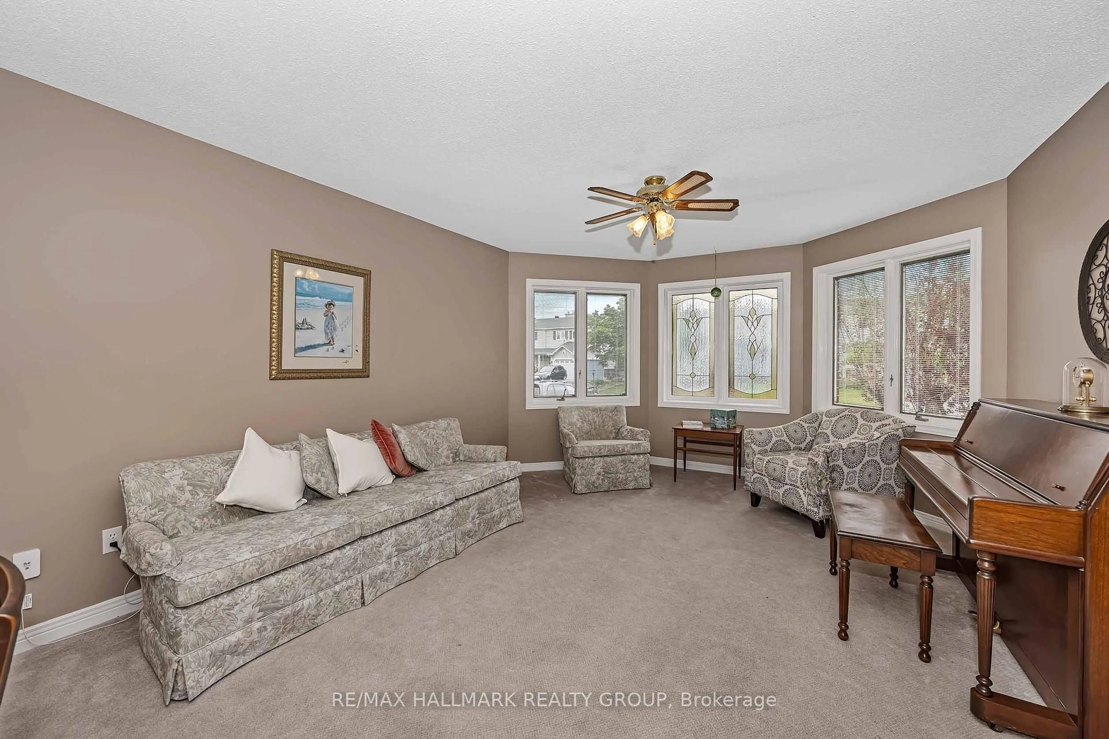 Living room with furniture, carpet floor for 18 Randall James Dr, Ottawa Ontario K2S 1L9
