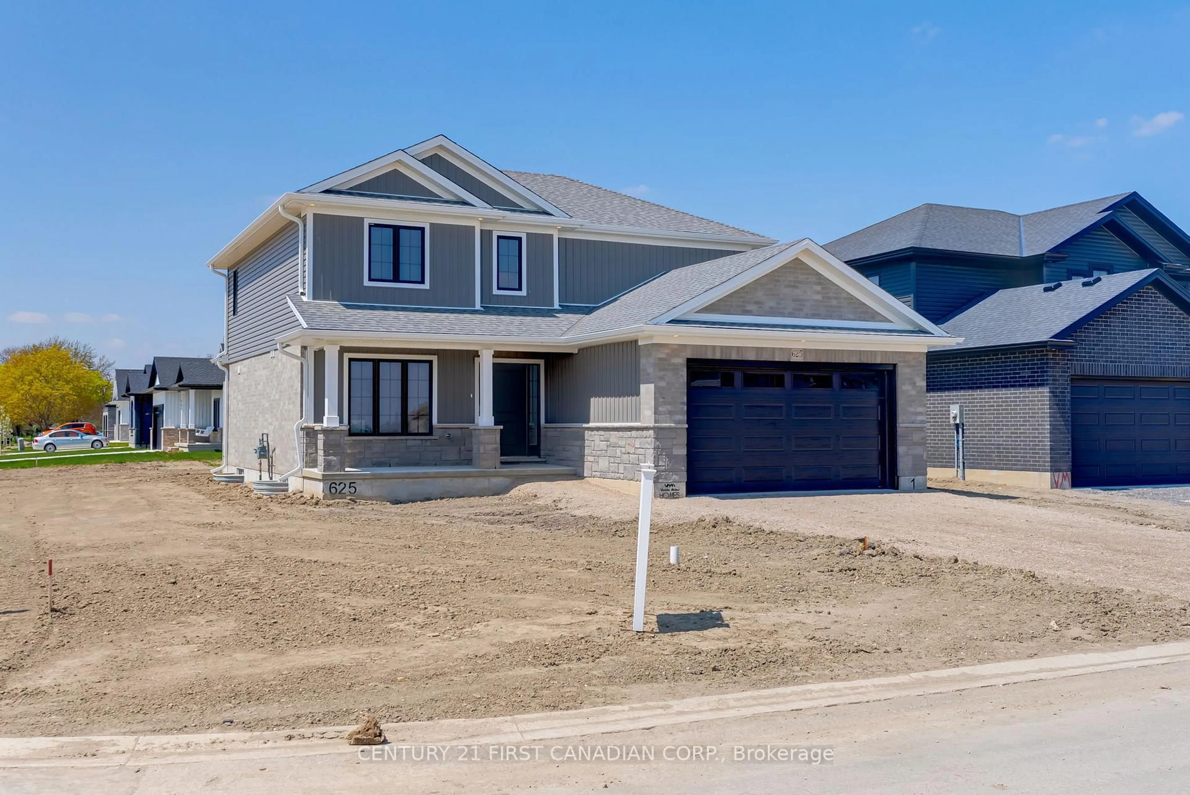 Home with vinyl exterior material, street for 106 Mapledene Lane, Lucan Biddulph Ontario N0M 2J0