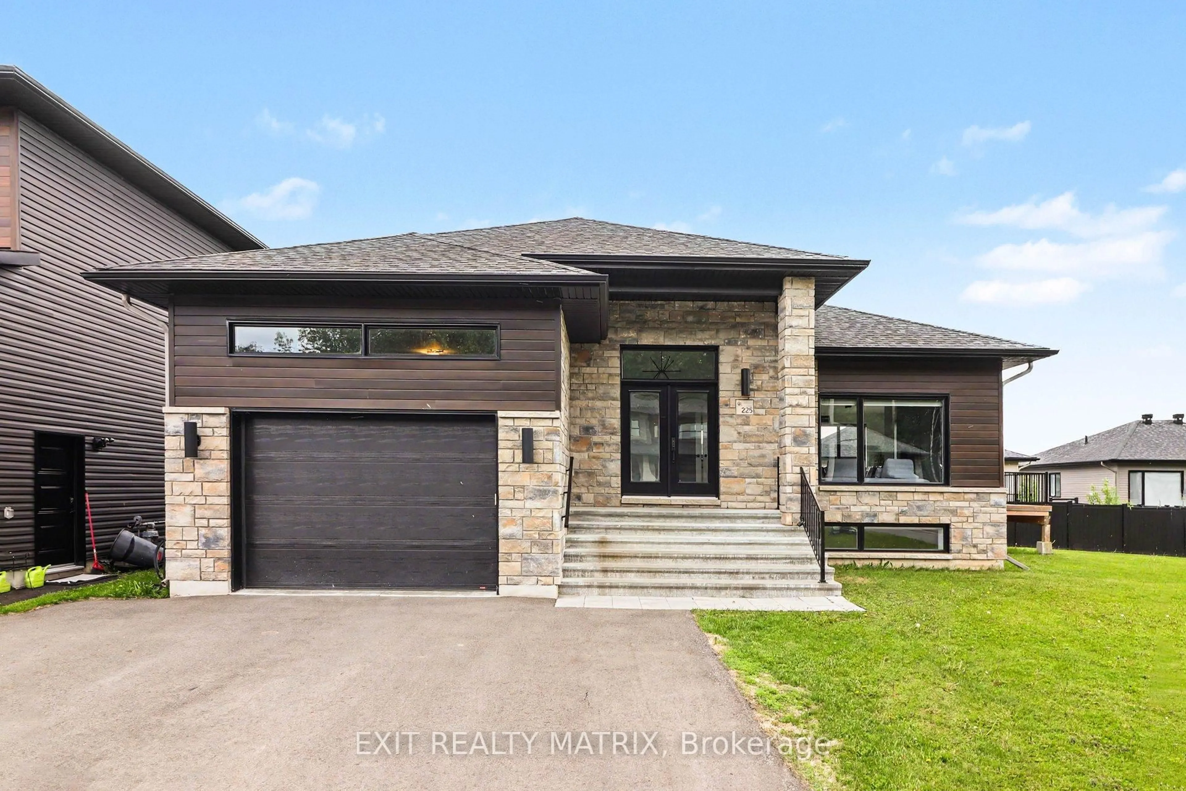 Home with brick exterior material, street for 225 Nature St, Casselman Ontario K0A 1M0