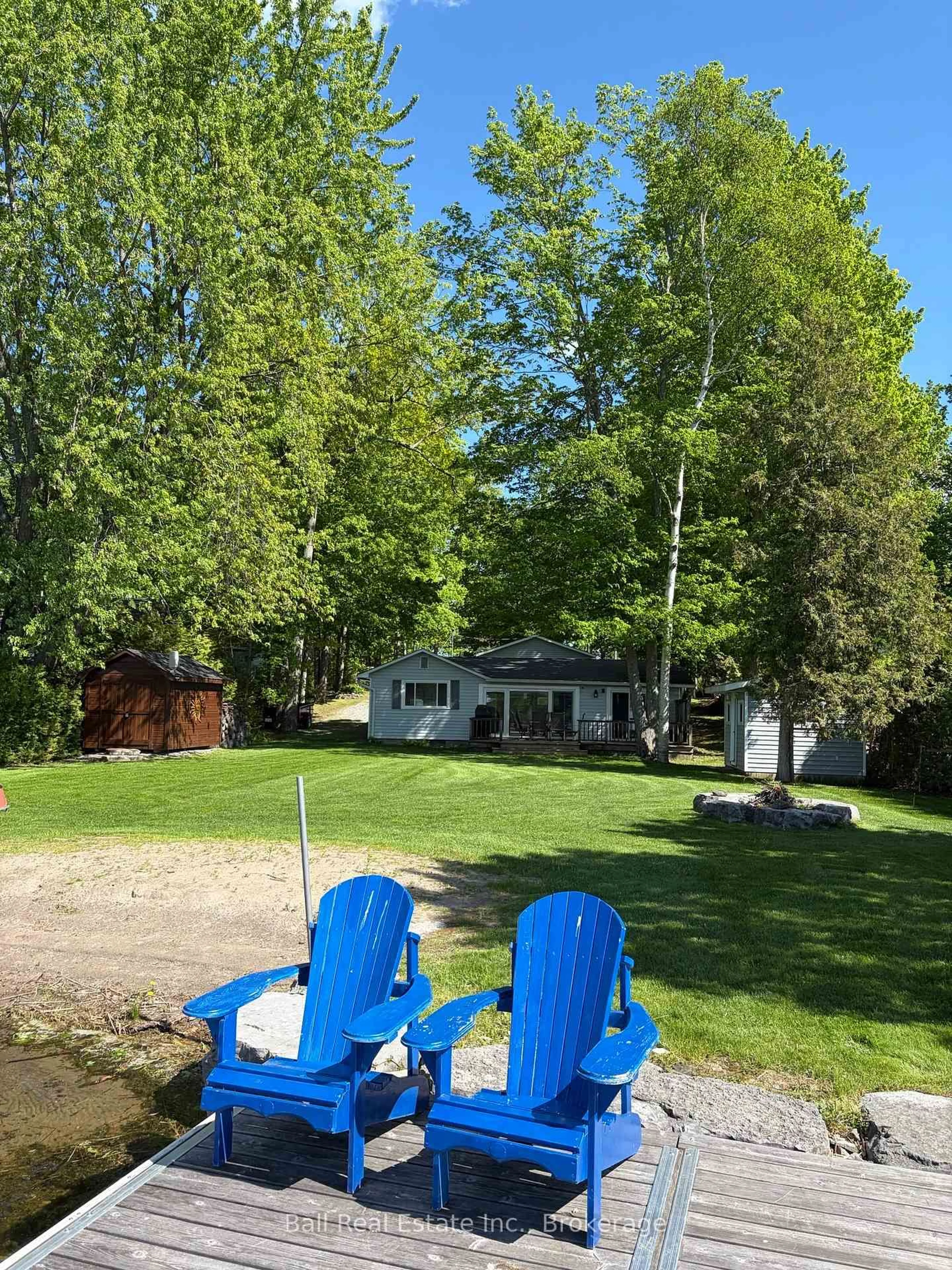 A pic from outside/outdoor area/front of a property/back of a property/a pic from drone, water/lake/river/ocean view for 58 Woodland Tr, Trent Lakes Ontario K0L 1J0