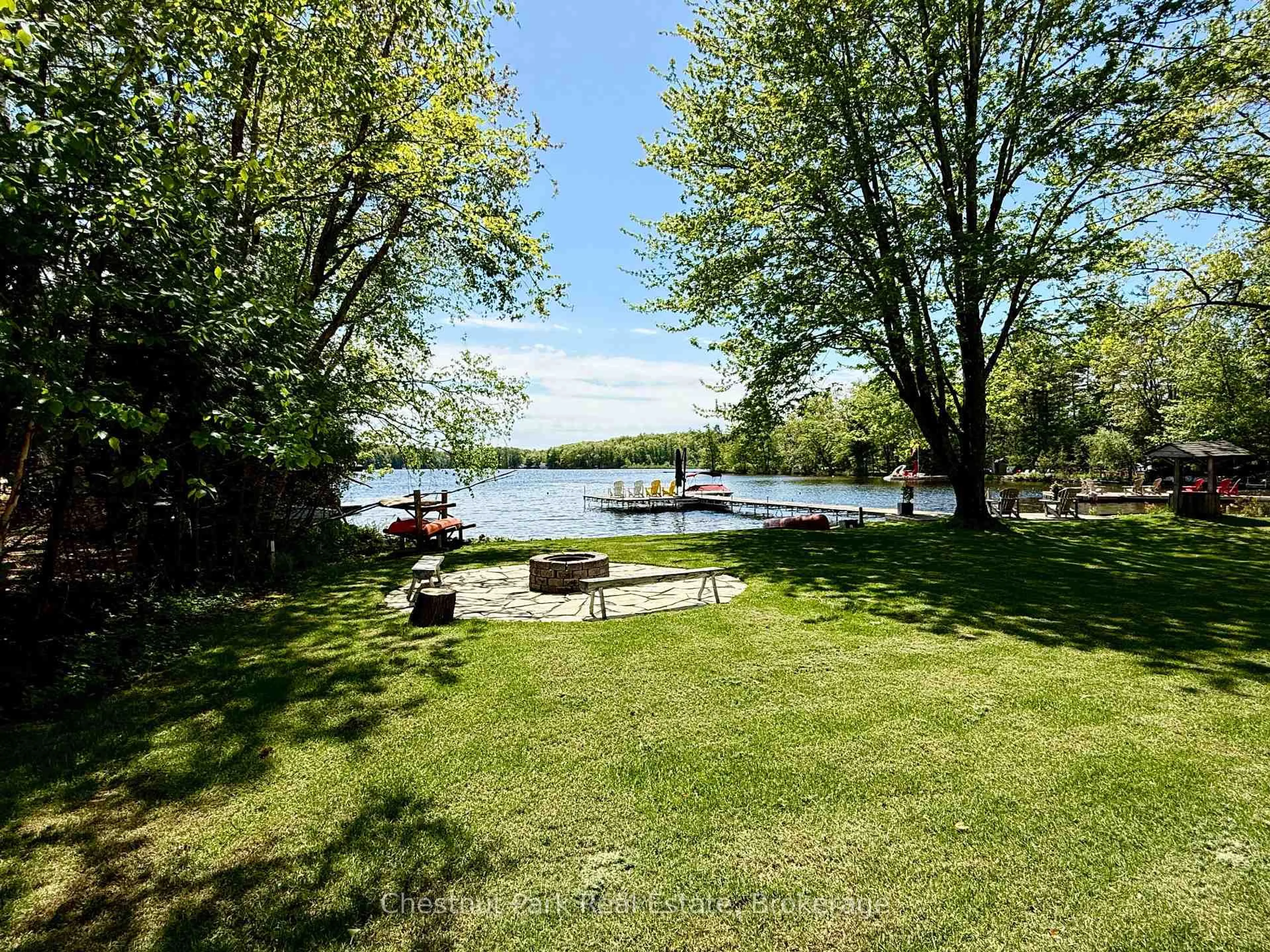 A pic from outside/outdoor area/front of a property/back of a property/a pic from drone, water/lake/river/ocean view for 1006 Bailey Lane, Bracebridge Ontario P1L 1X2