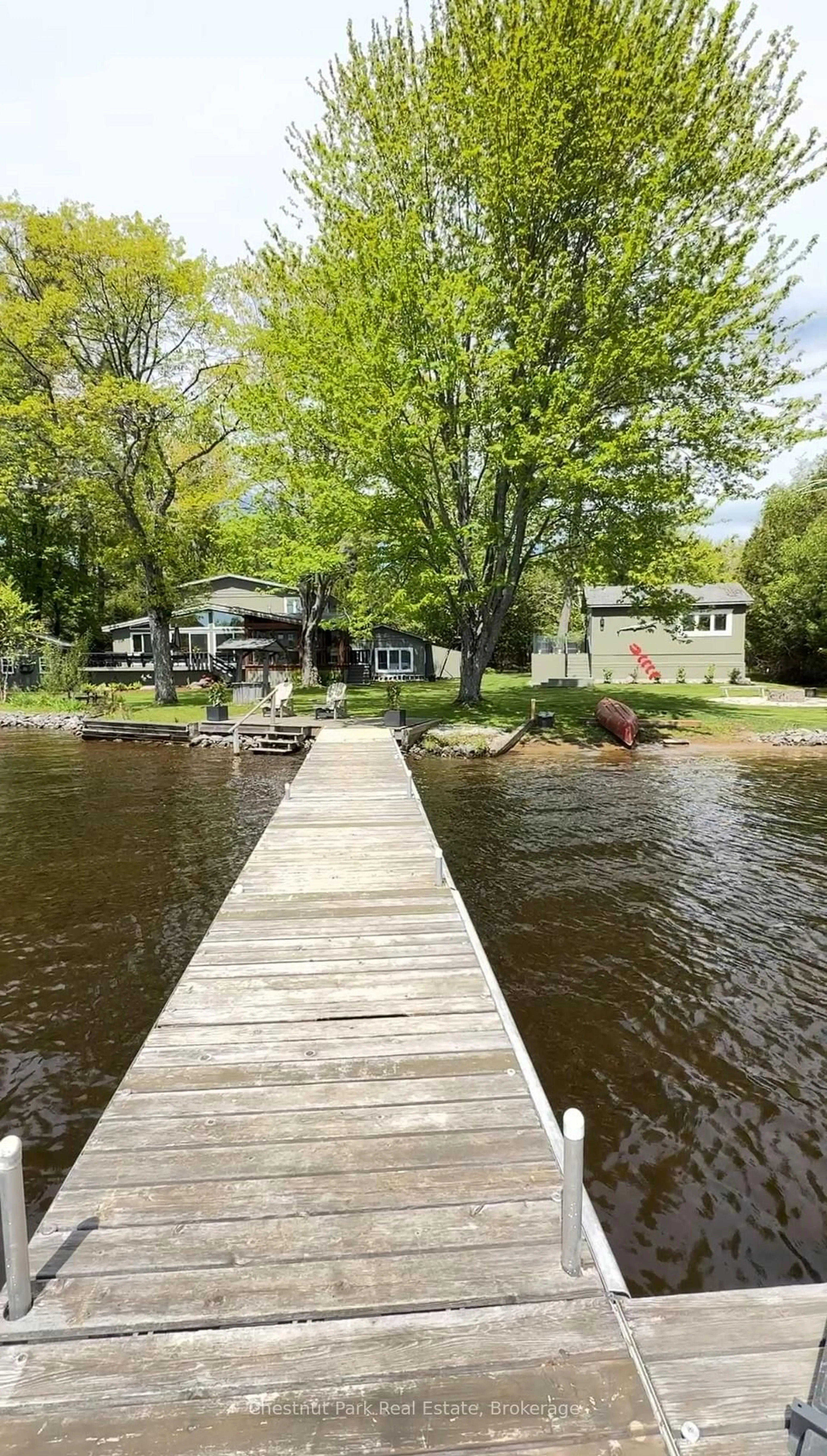 A pic from outside/outdoor area/front of a property/back of a property/a pic from drone, water/lake/river/ocean view for 1006 Bailey Lane, Bracebridge Ontario P1L 1X2
