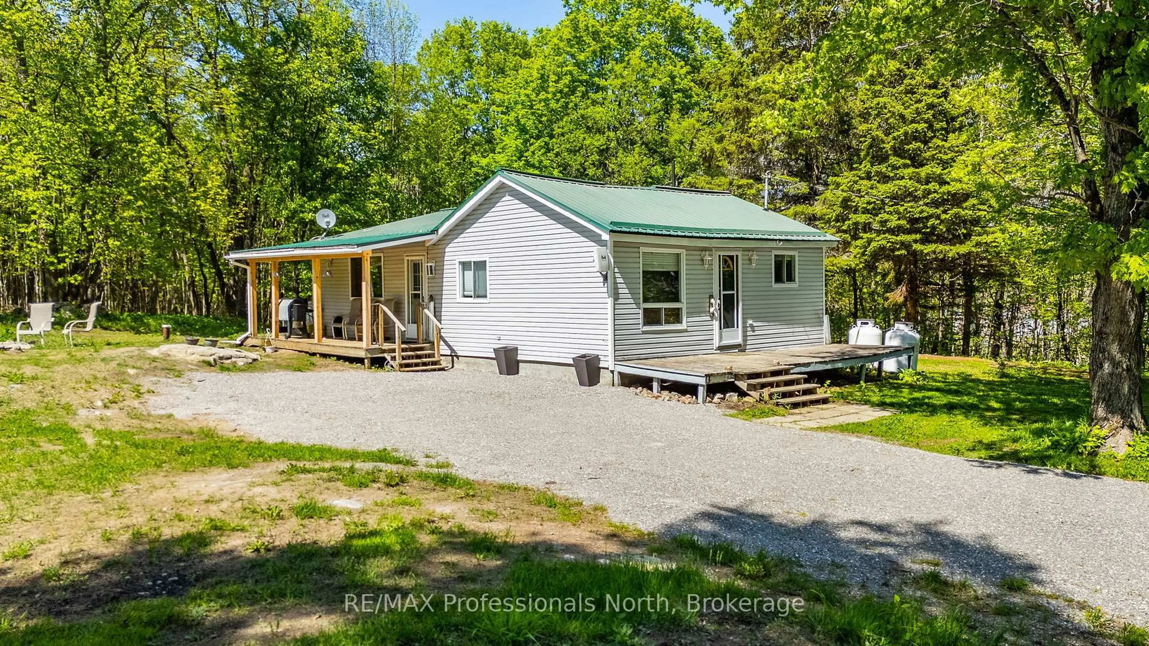 A pic from outside/outdoor area/front of a property/back of a property/a pic from drone, street for 1577 Bethel Rd, Minden Hills Ontario K0M 2K0