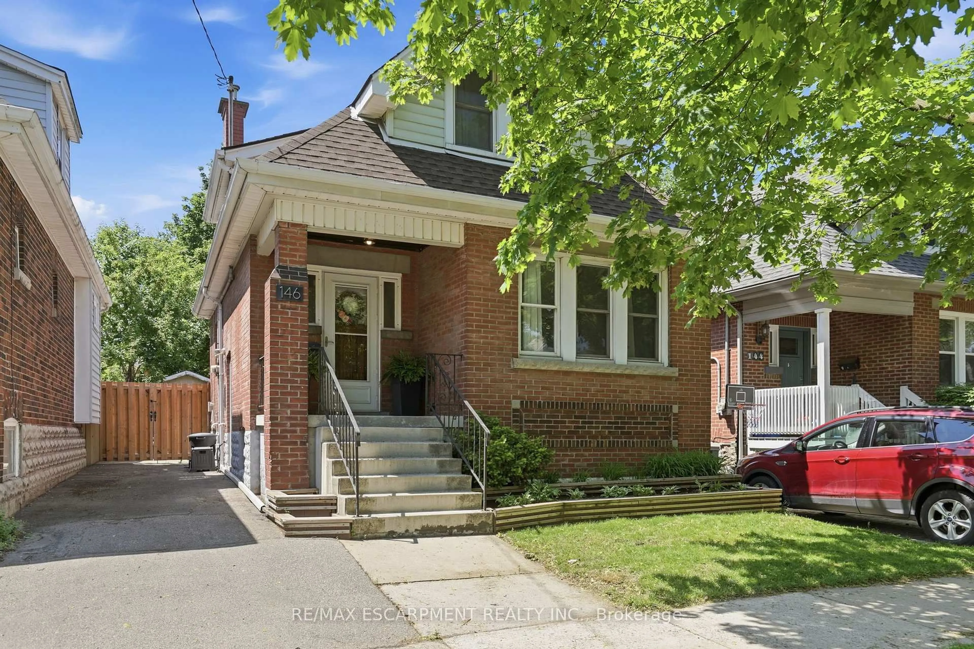 Home with brick exterior material, street for 146 Park Row, Hamilton Ontario L8K 2J8