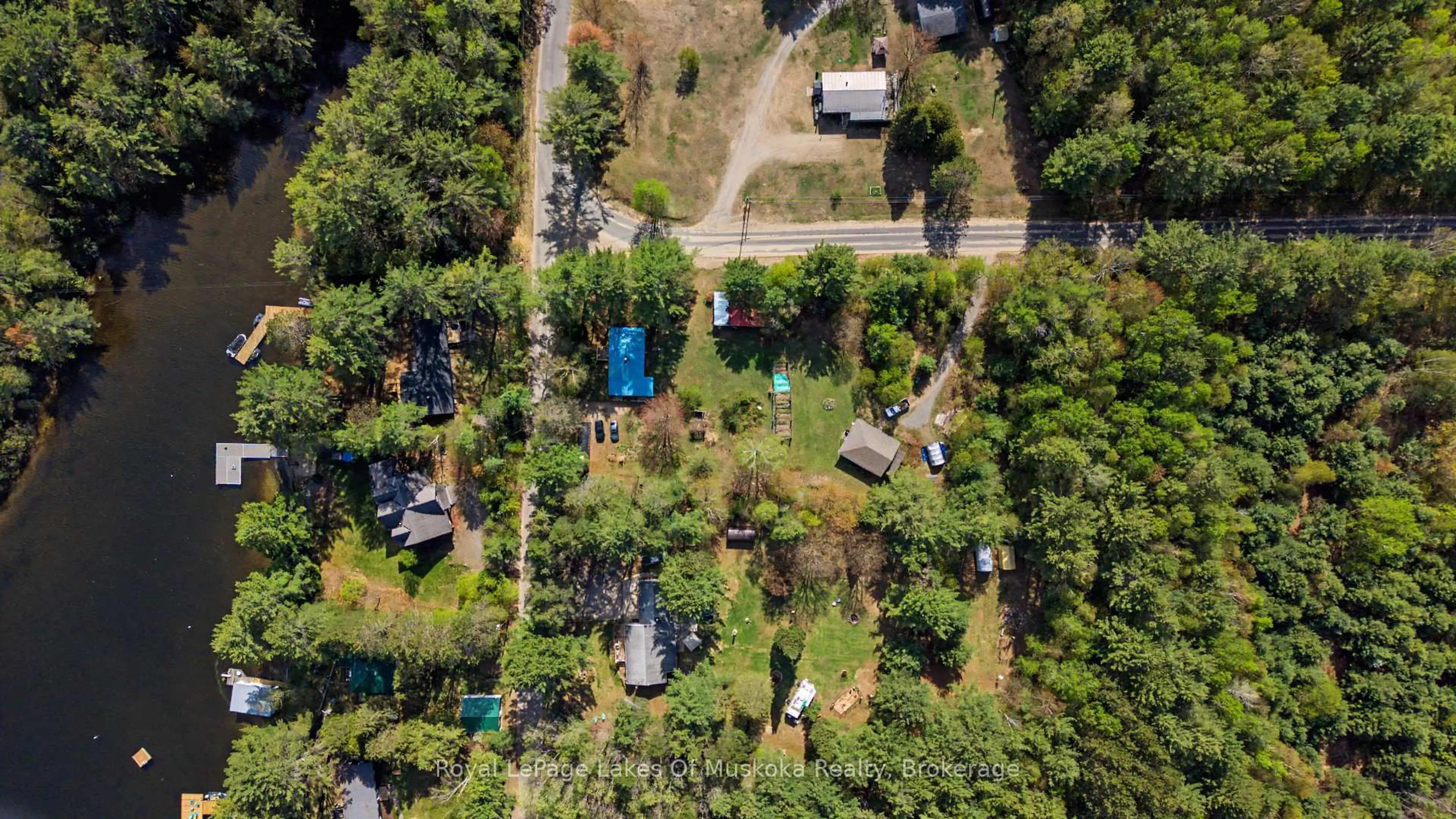 A pic from outside/outdoor area/front of a property/back of a property/a pic from drone, forest/trees view for 1003 Kelly Rd, Lake of Bays Ontario P0B 1A0
