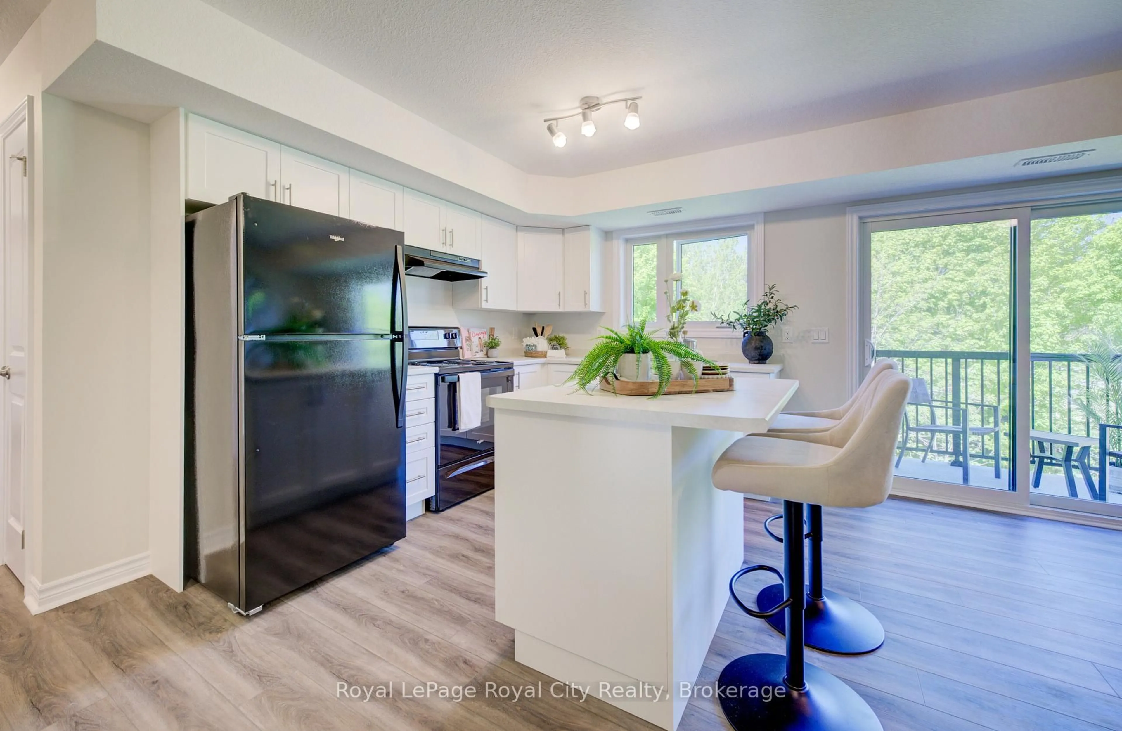 Open concept kitchen, wood/laminate floor for 465 Garafraxa St #9, Centre Wellington Ontario N1M 0L6
