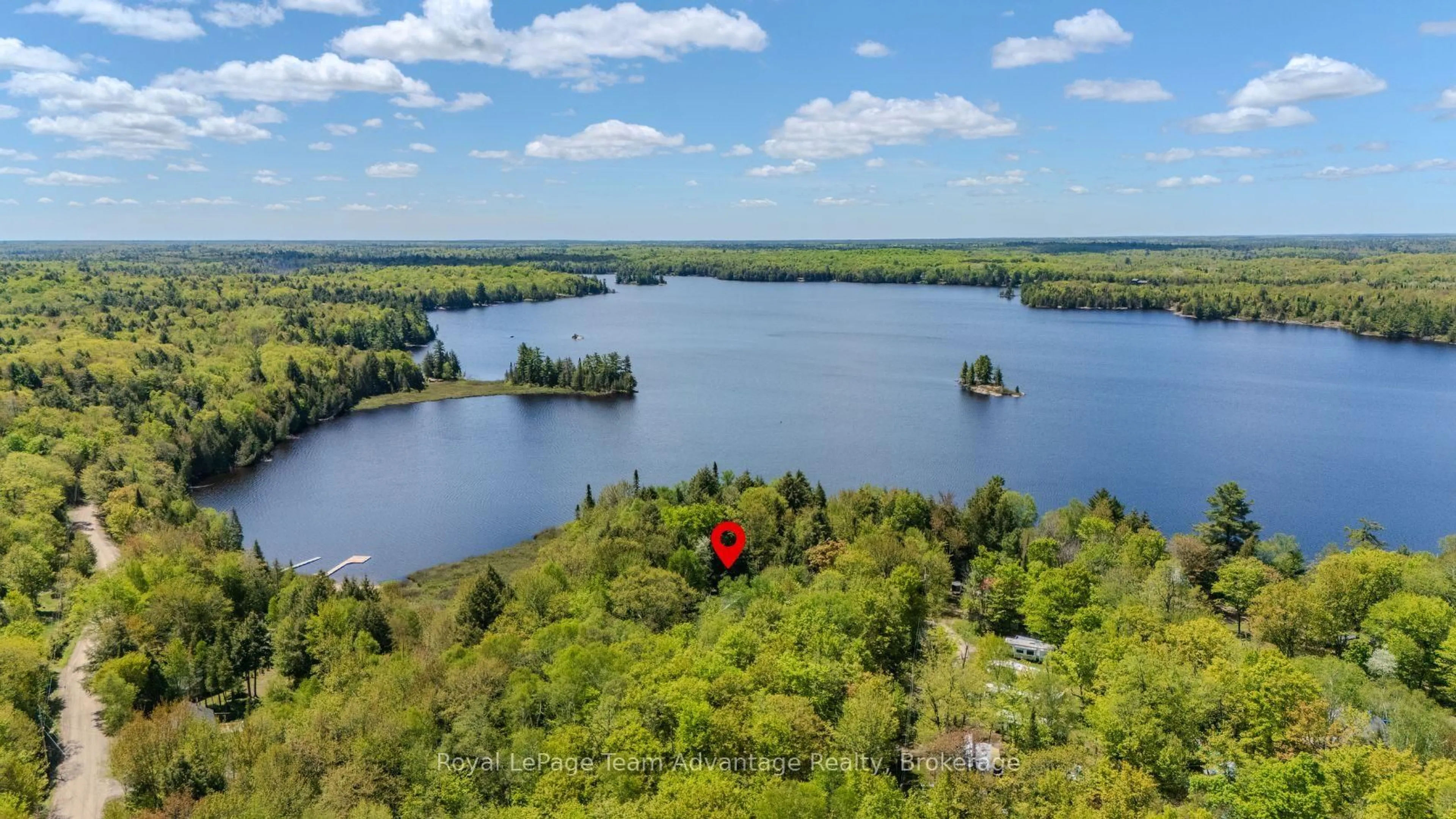 A pic from outside/outdoor area/front of a property/back of a property/a pic from drone, water/lake/river/ocean view for 548C East Bear Lake Rd, McMurrich/Monteith Ontario P0A 1Y0