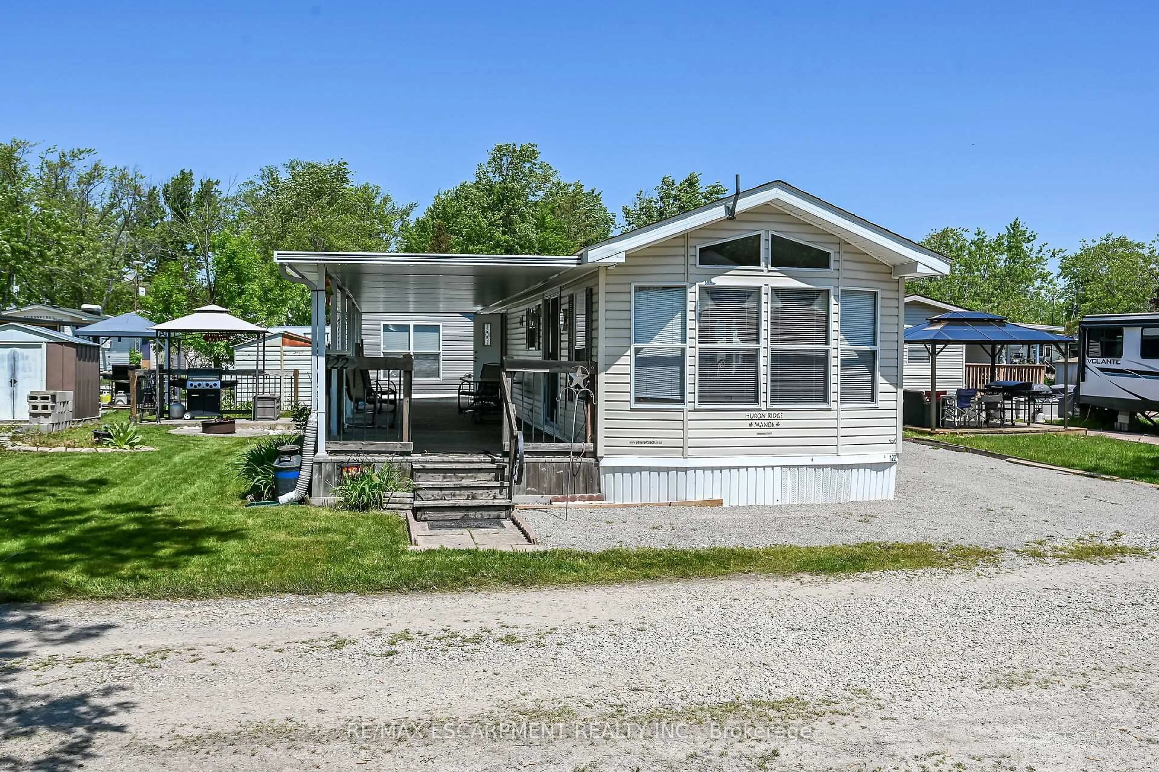 Home with vinyl exterior material, street for 1001 Haldimand Road 17 #122, Haldimand Ontario N0A 1E0