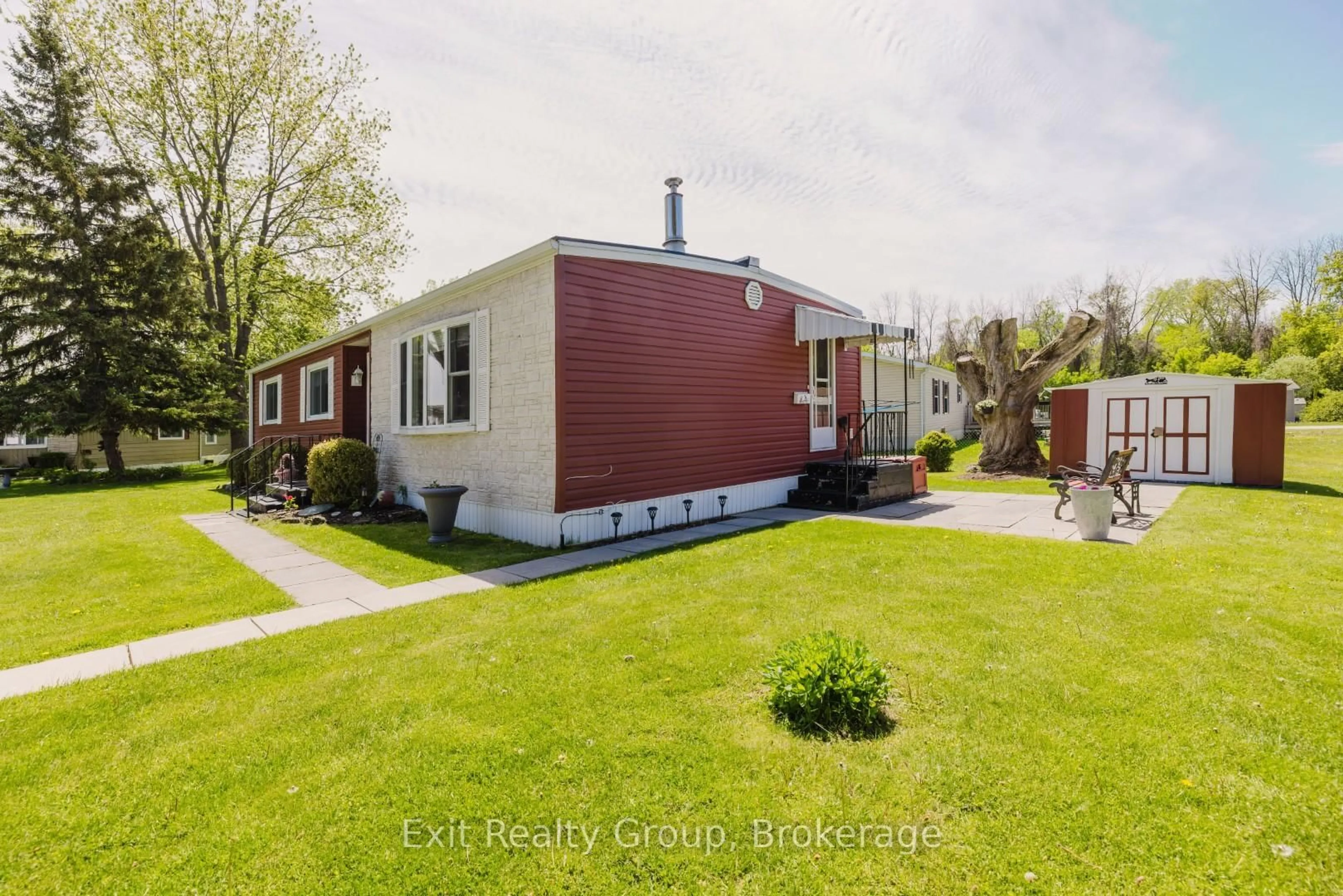 A pic from outside/outdoor area/front of a property/back of a property/a pic from drone, street for 63 Whites Rd #172, Quinte West Ontario K8V 5P5