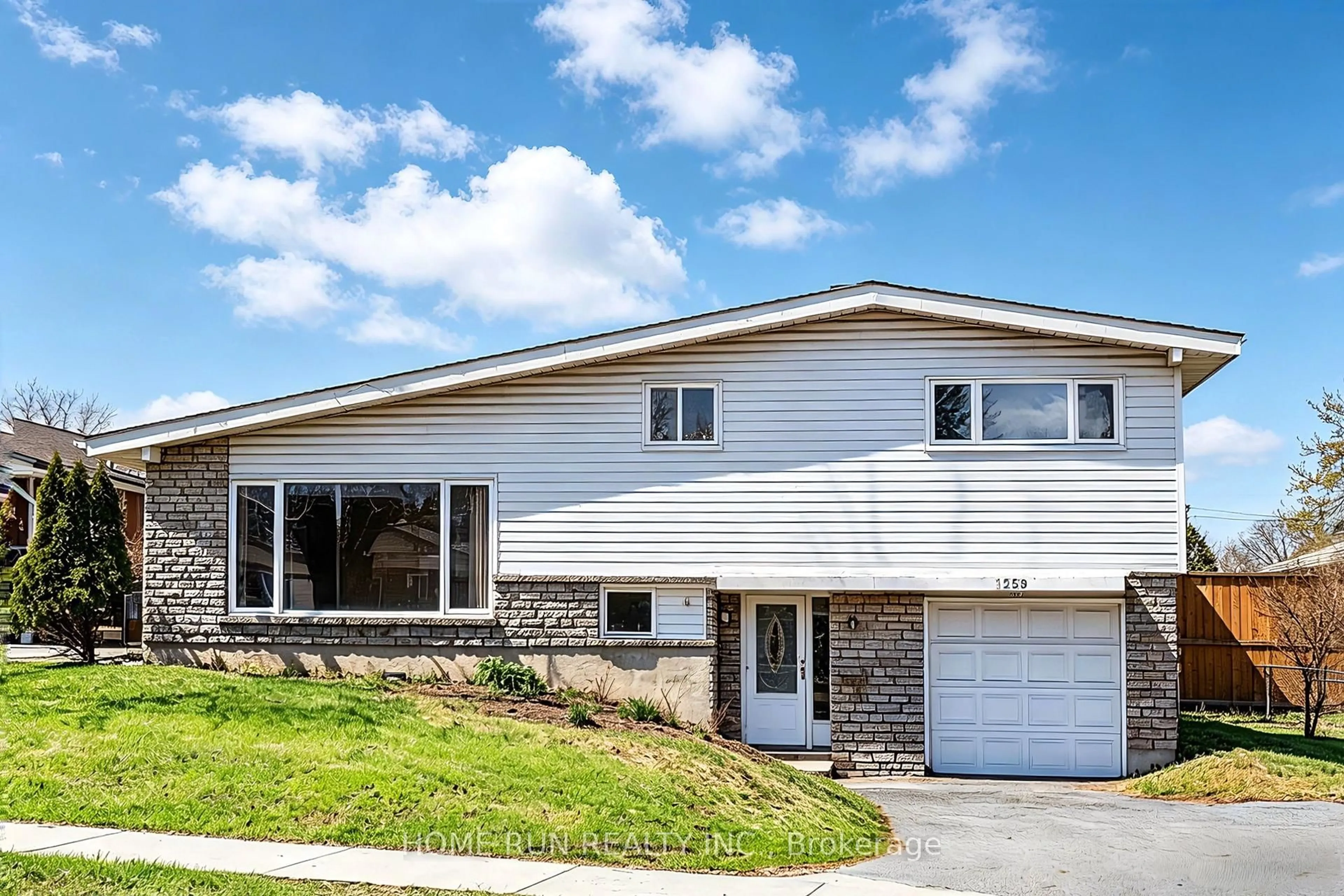 Home with vinyl exterior material, street for 1259 Meadowlands Dr, Ottawa Ontario K2E 6K4