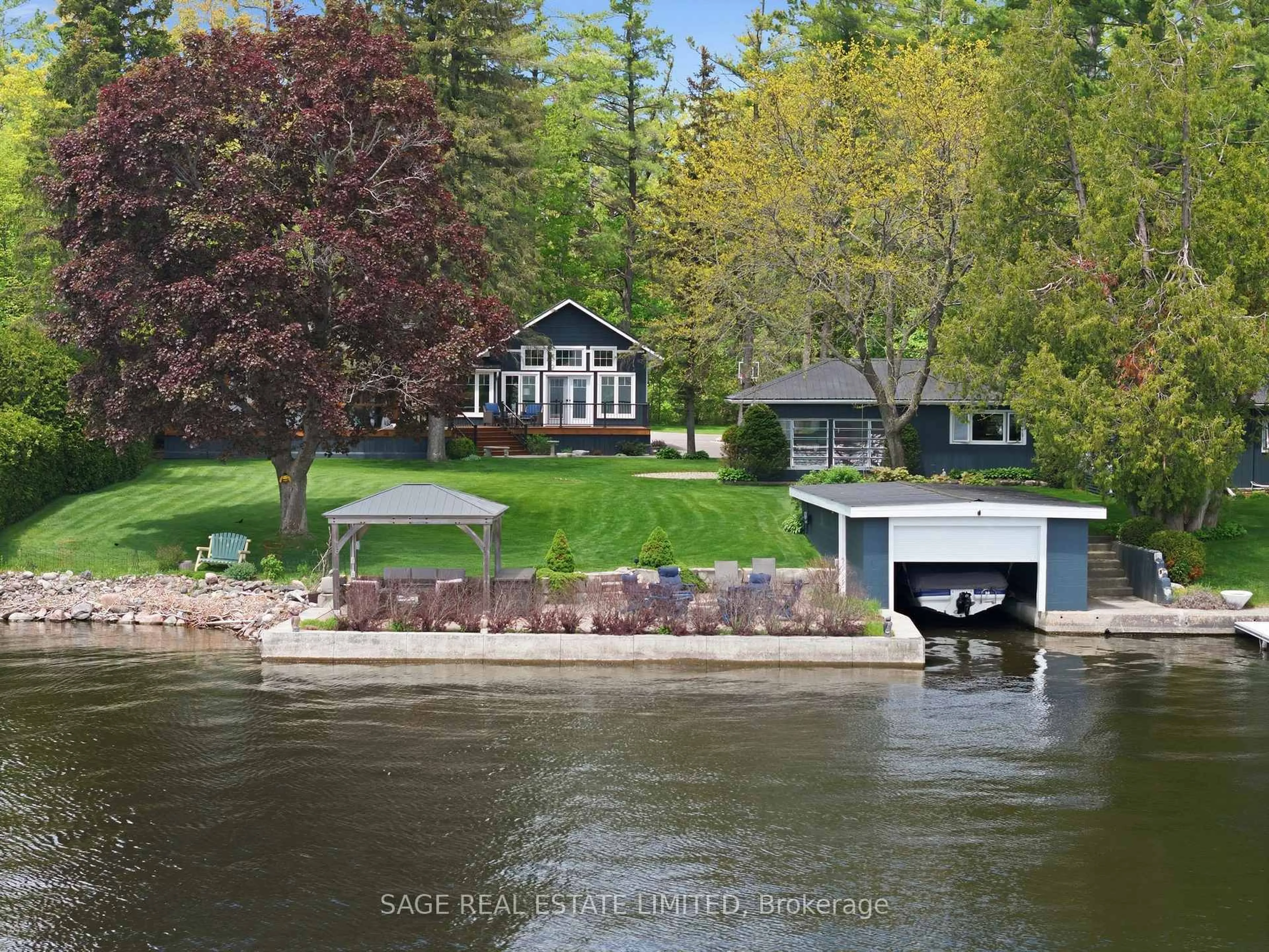 A pic from outside/outdoor area/front of a property/back of a property/a pic from drone, water/lake/river/ocean view for 141 Sandy Point Rd, Kawartha Lakes Ontario K0M 1N0