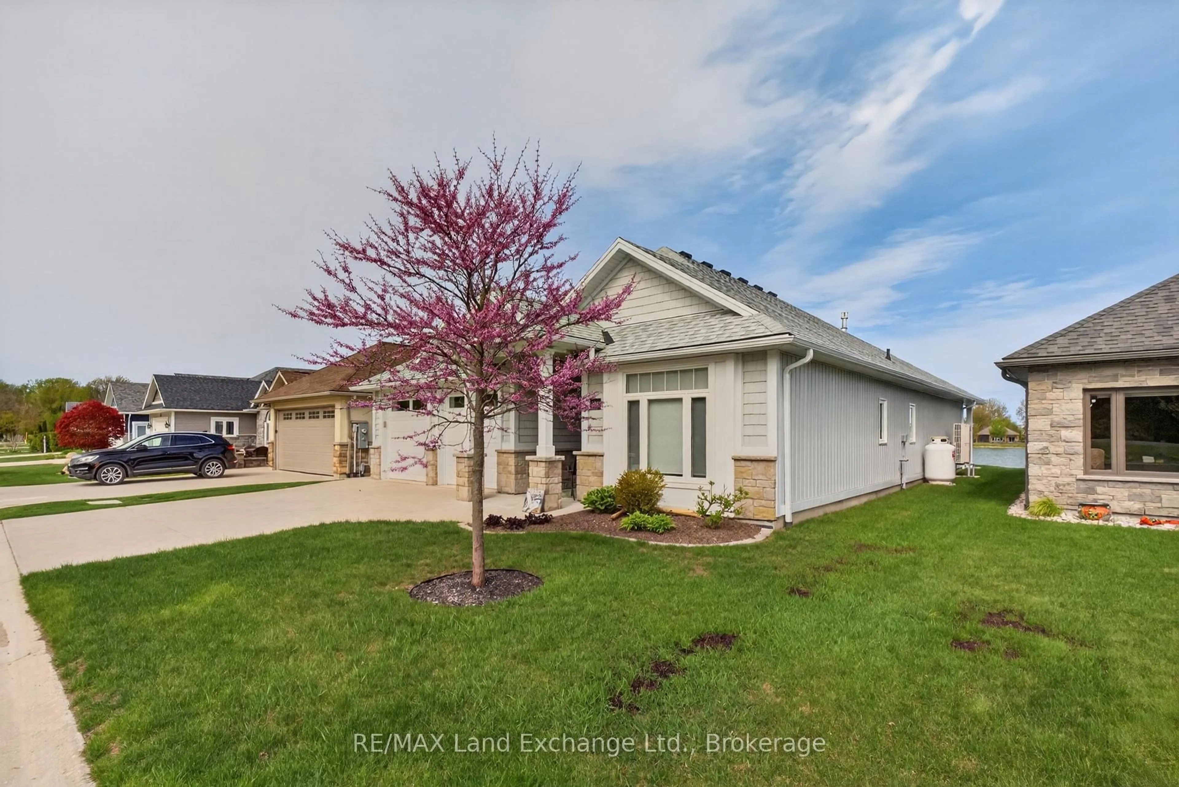 A pic from outside/outdoor area/front of a property/back of a property/a pic from drone, street for 221 Carloway Tr #15, Huron-Kinloss Ontario N2Z 0A4