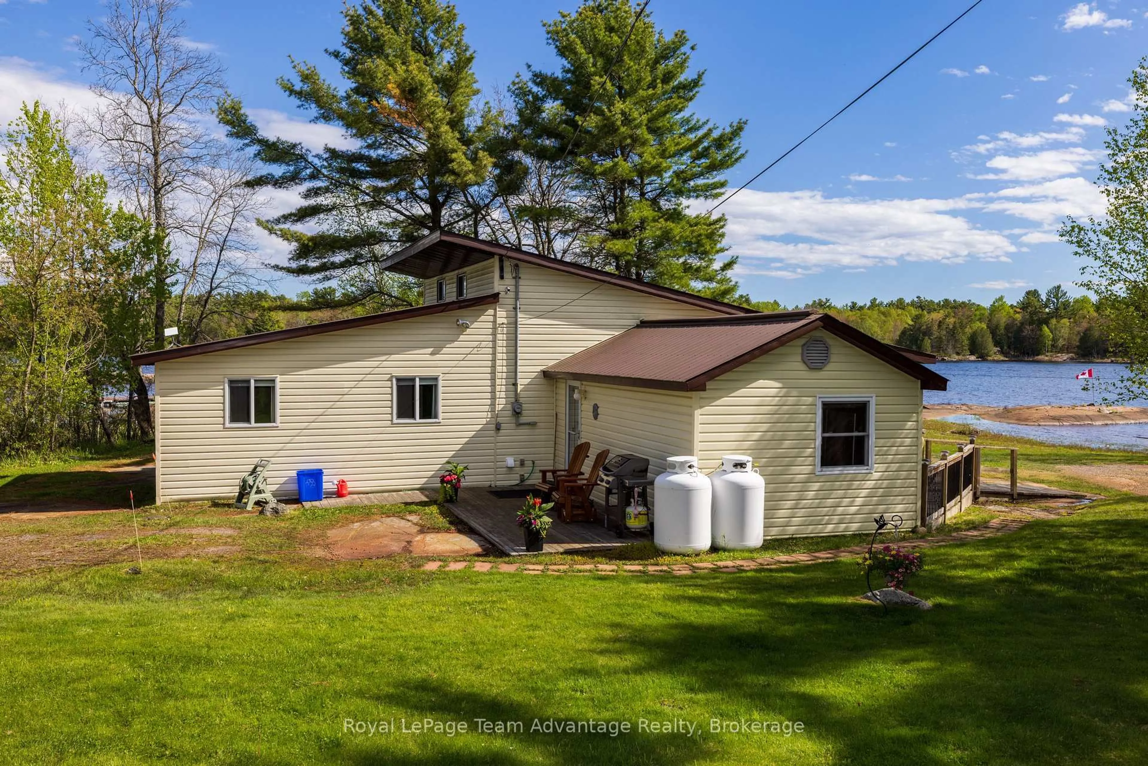 A pic from outside/outdoor area/front of a property/back of a property/a pic from drone, water/lake/river/ocean view for 2420 Riverside Dr, Parry Sound Remote Area Ontario P0G 1A0