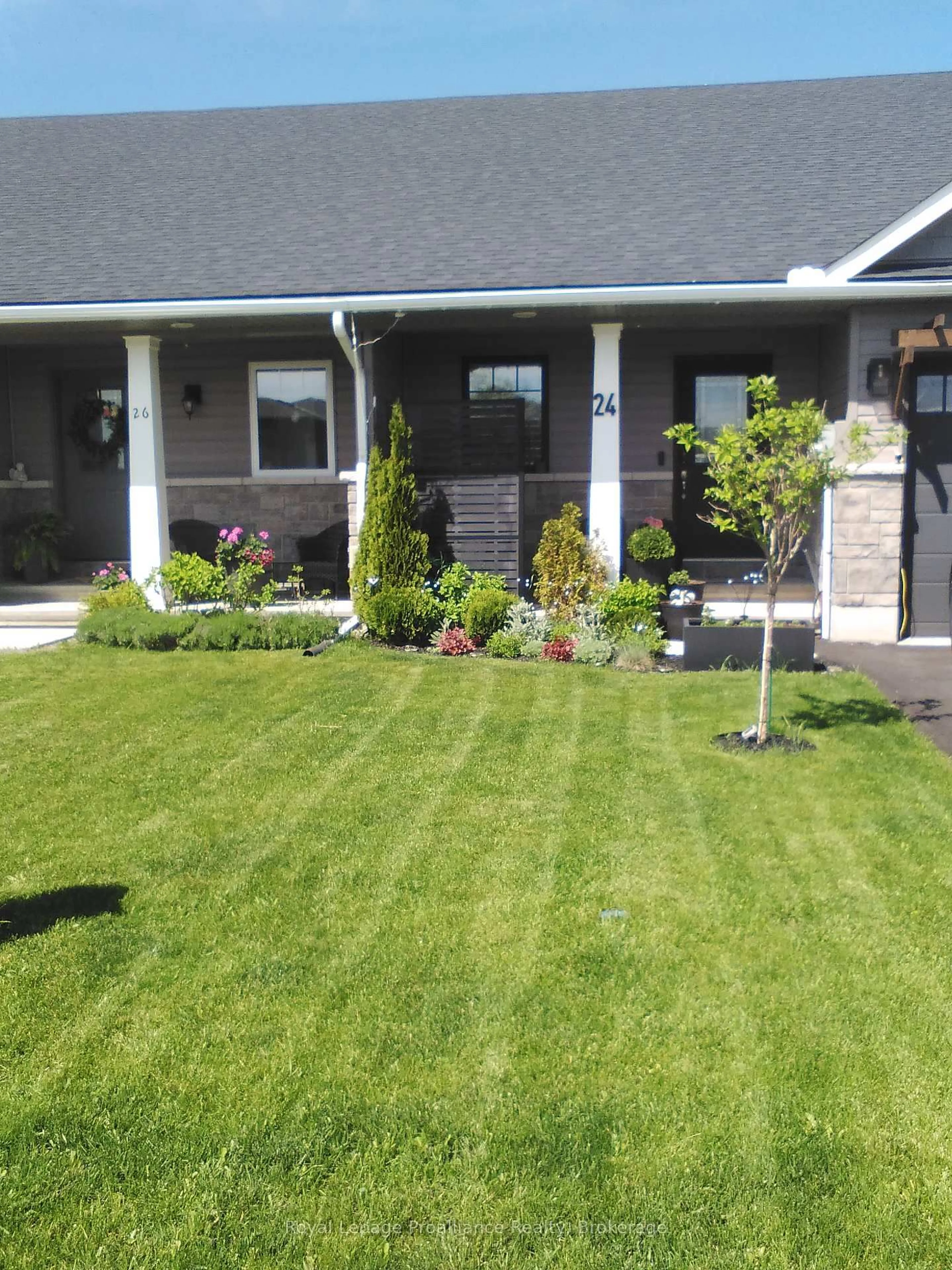 Home with vinyl exterior material, street for 24 Buchanan Ave, Prince Edward County Ontario K0K 2T0