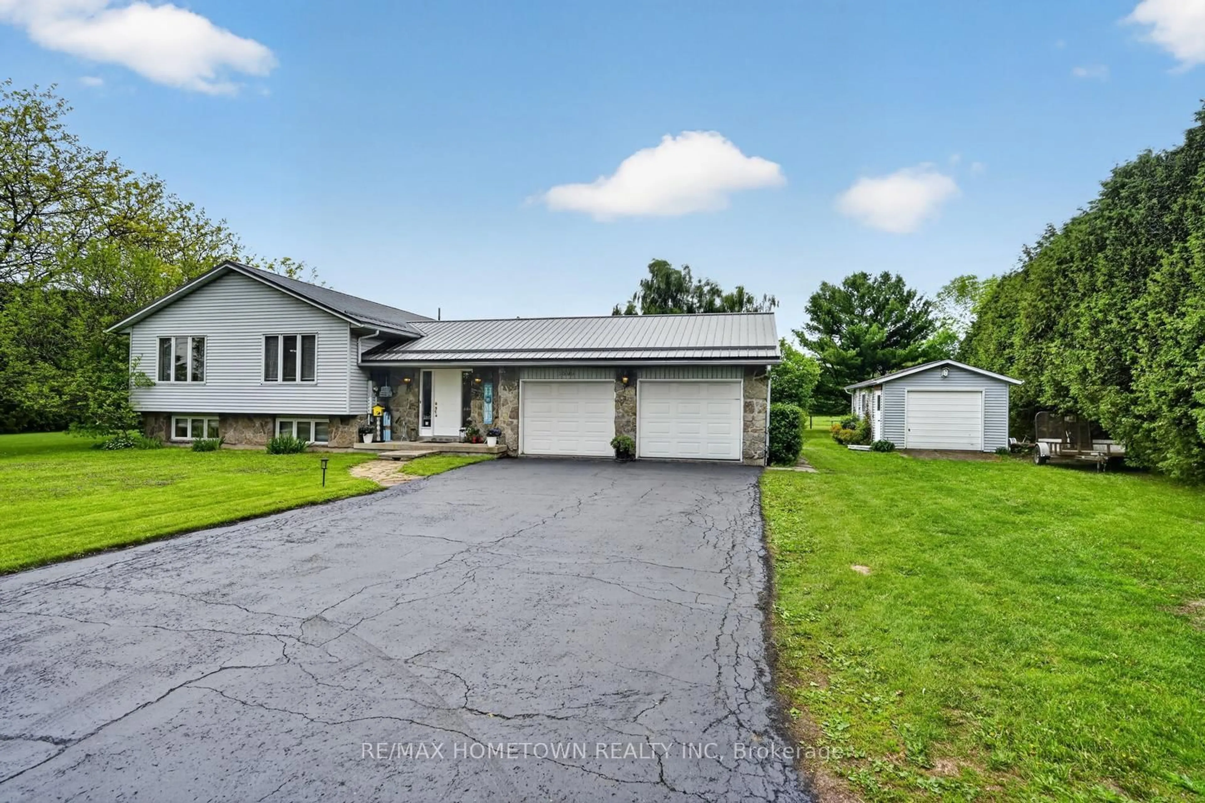 A pic from outside/outdoor area/front of a property/back of a property/a pic from drone, street for 1599 County Rd 2 Rd, Front of Yonge Ontario K0E 1R0