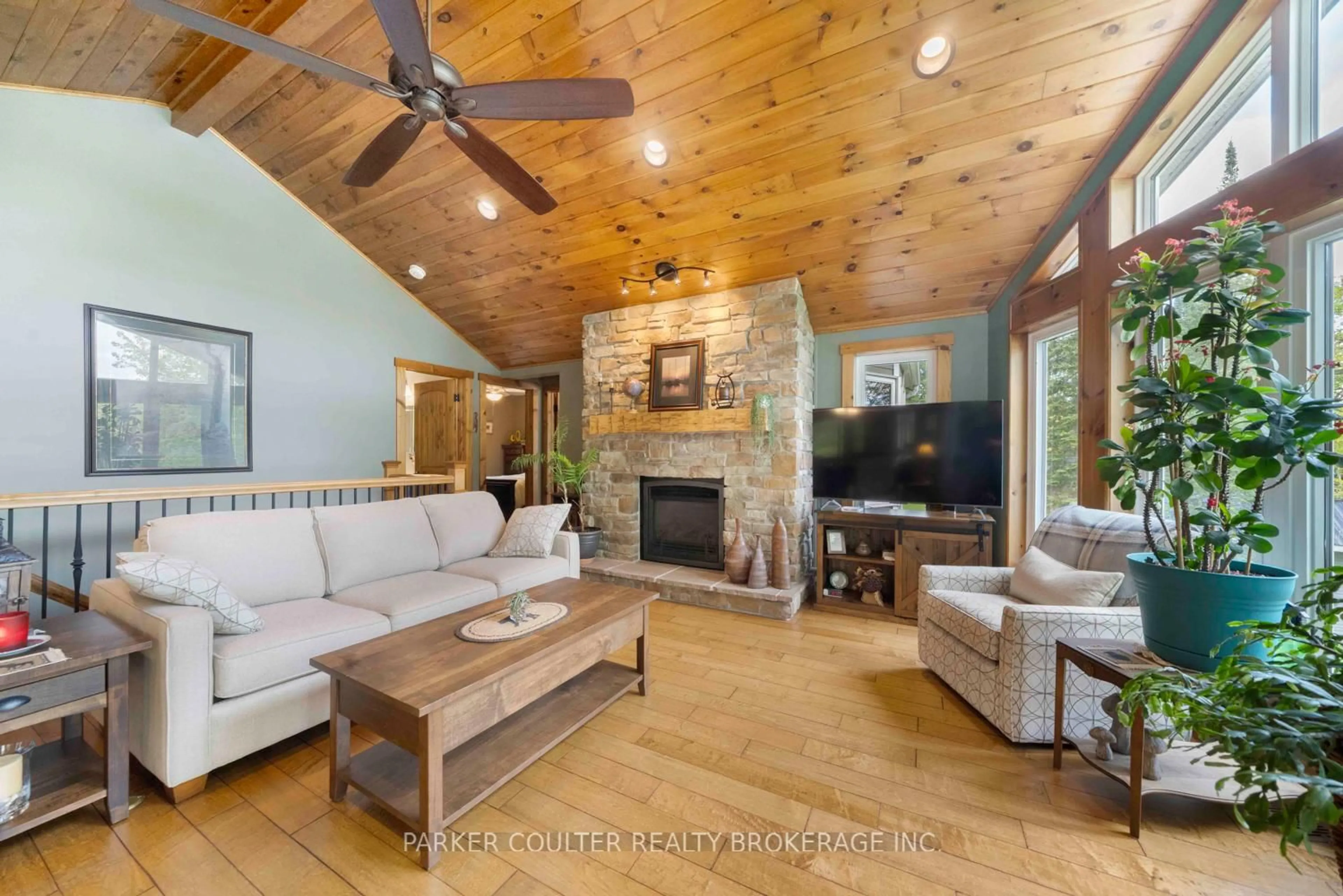 Living room with furniture, wood/laminate floor for 96 Sunnyshores Estates Rd, Seguin Ontario P2A 2W9
