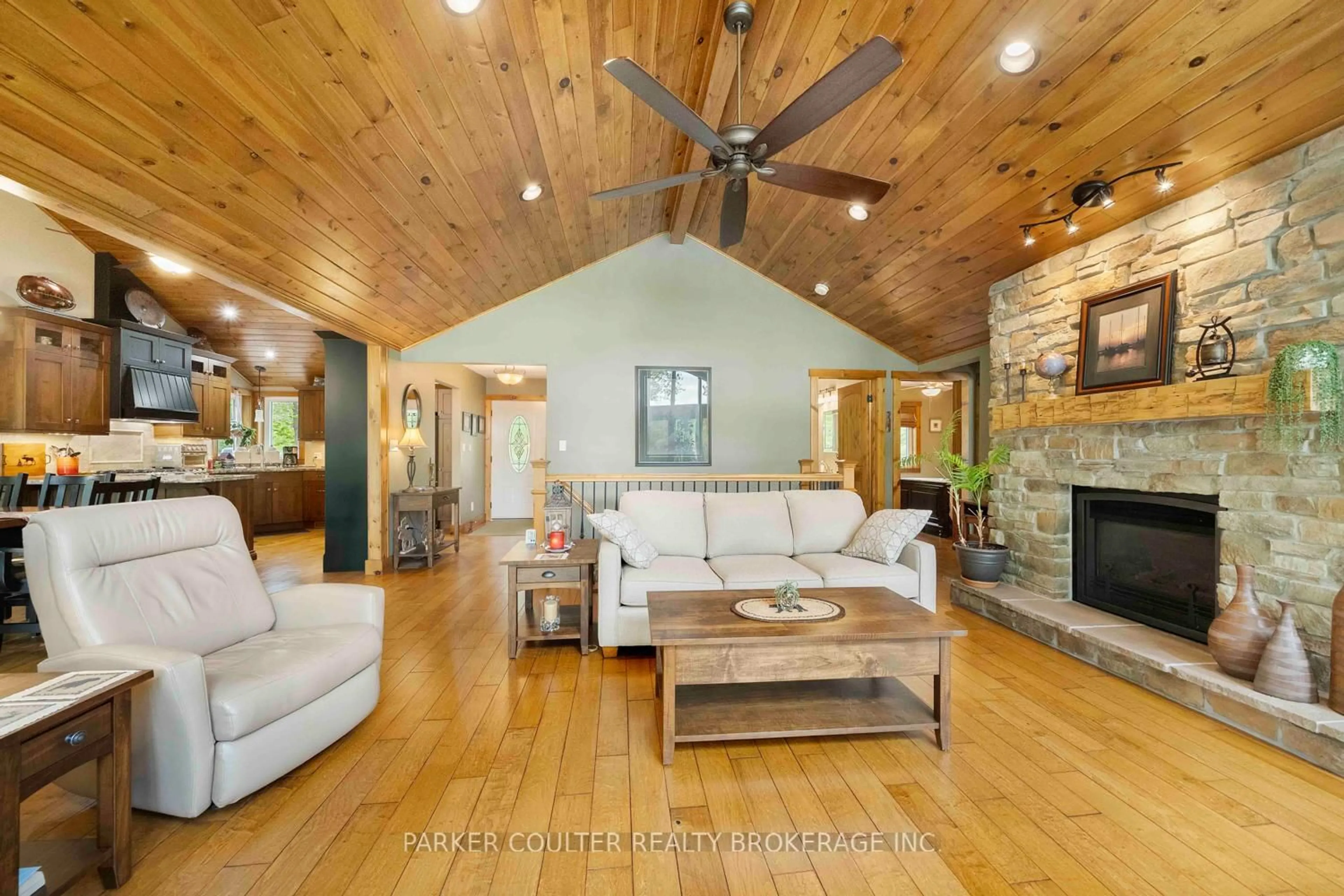 Living room with furniture, wood/laminate floor for 96 Sunnyshores Estates Rd, Seguin Ontario P2A 2W9