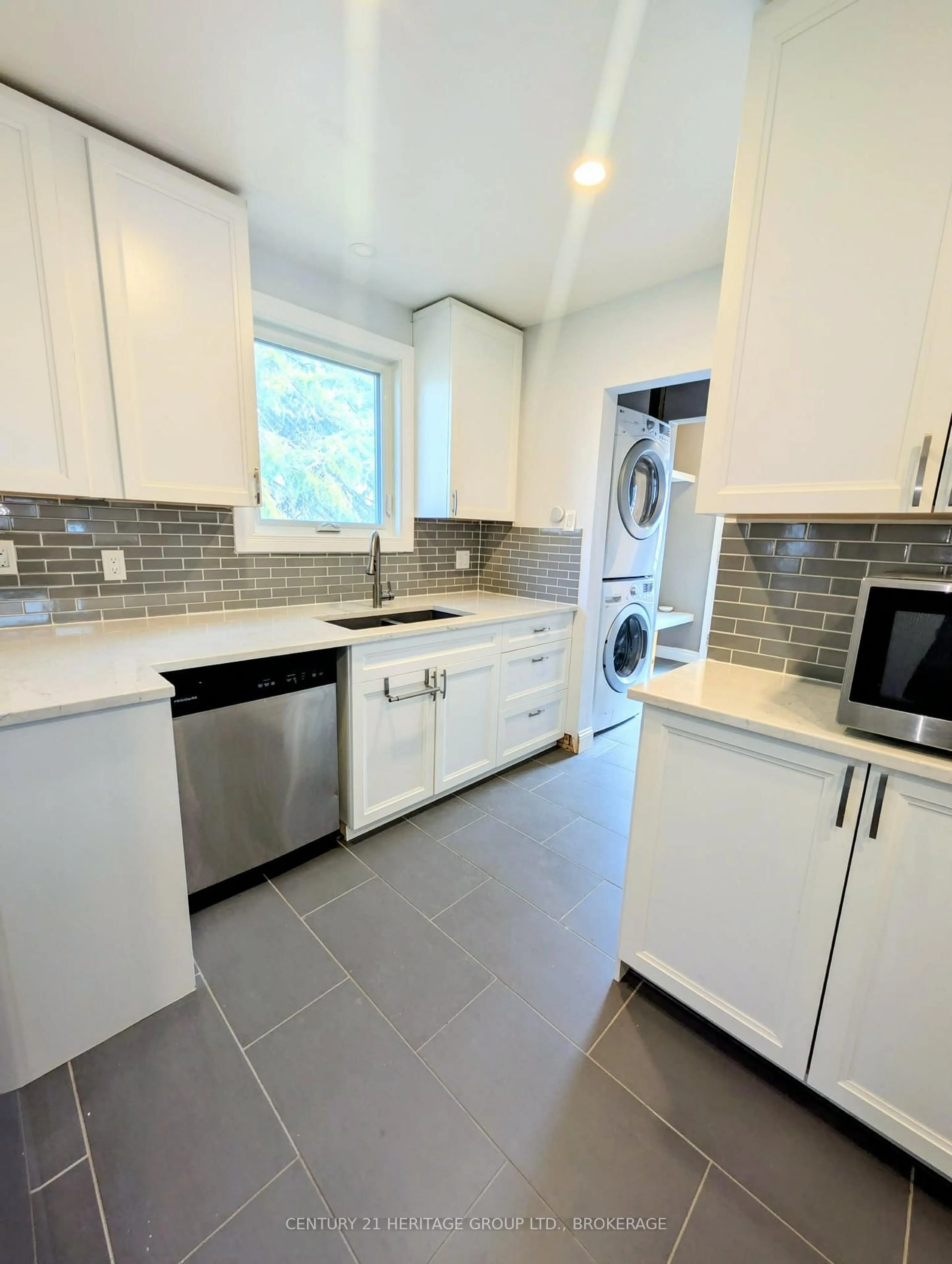 Kitchen with laundary machines, ceramic/tile floor for 155 Carruthers Ave, Kingston Ontario K7L 1M8