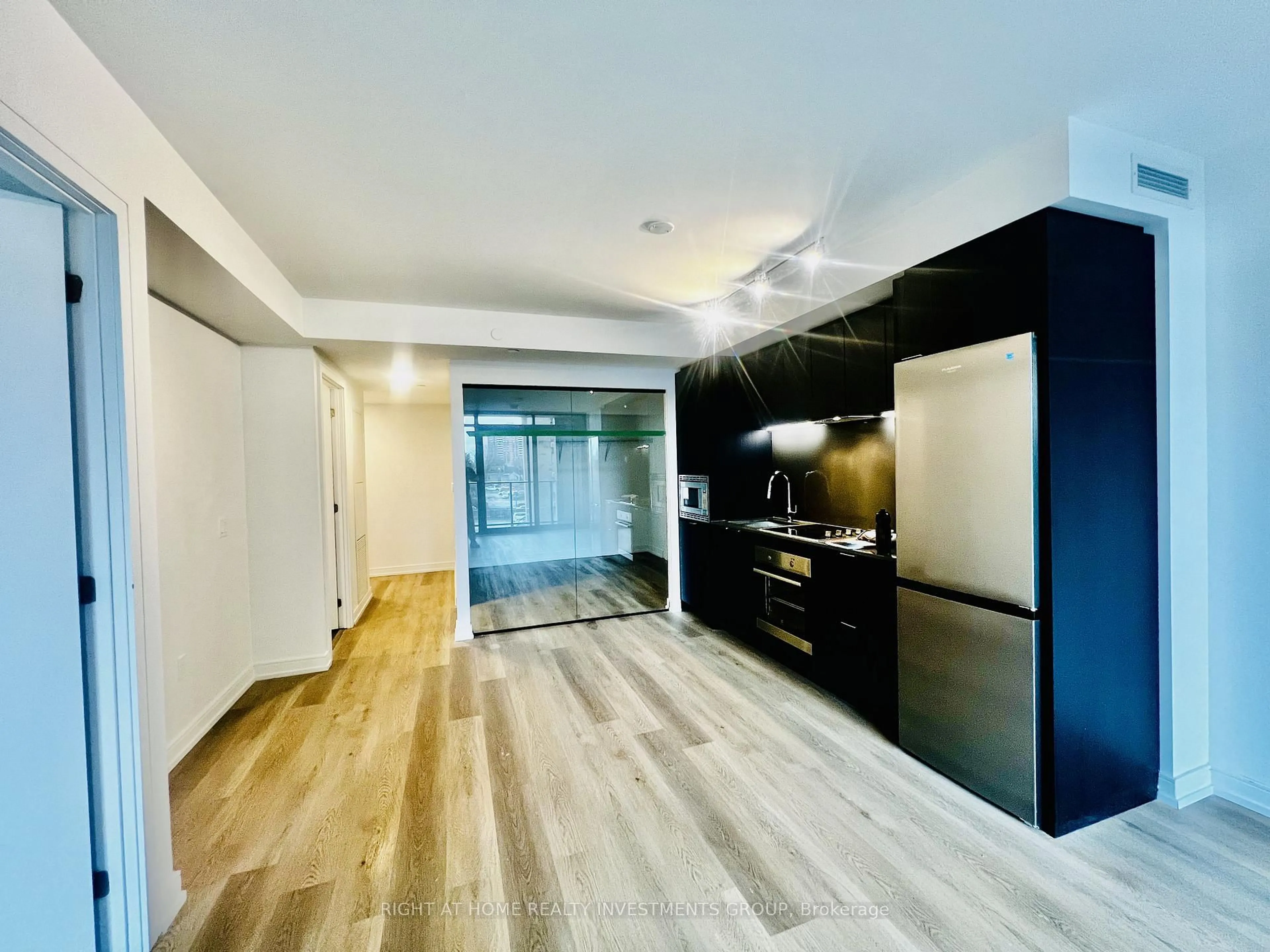Open concept kitchen, wood/laminate floor for 1 Jarvis St #327, Hamilton Ontario L8R 3J2