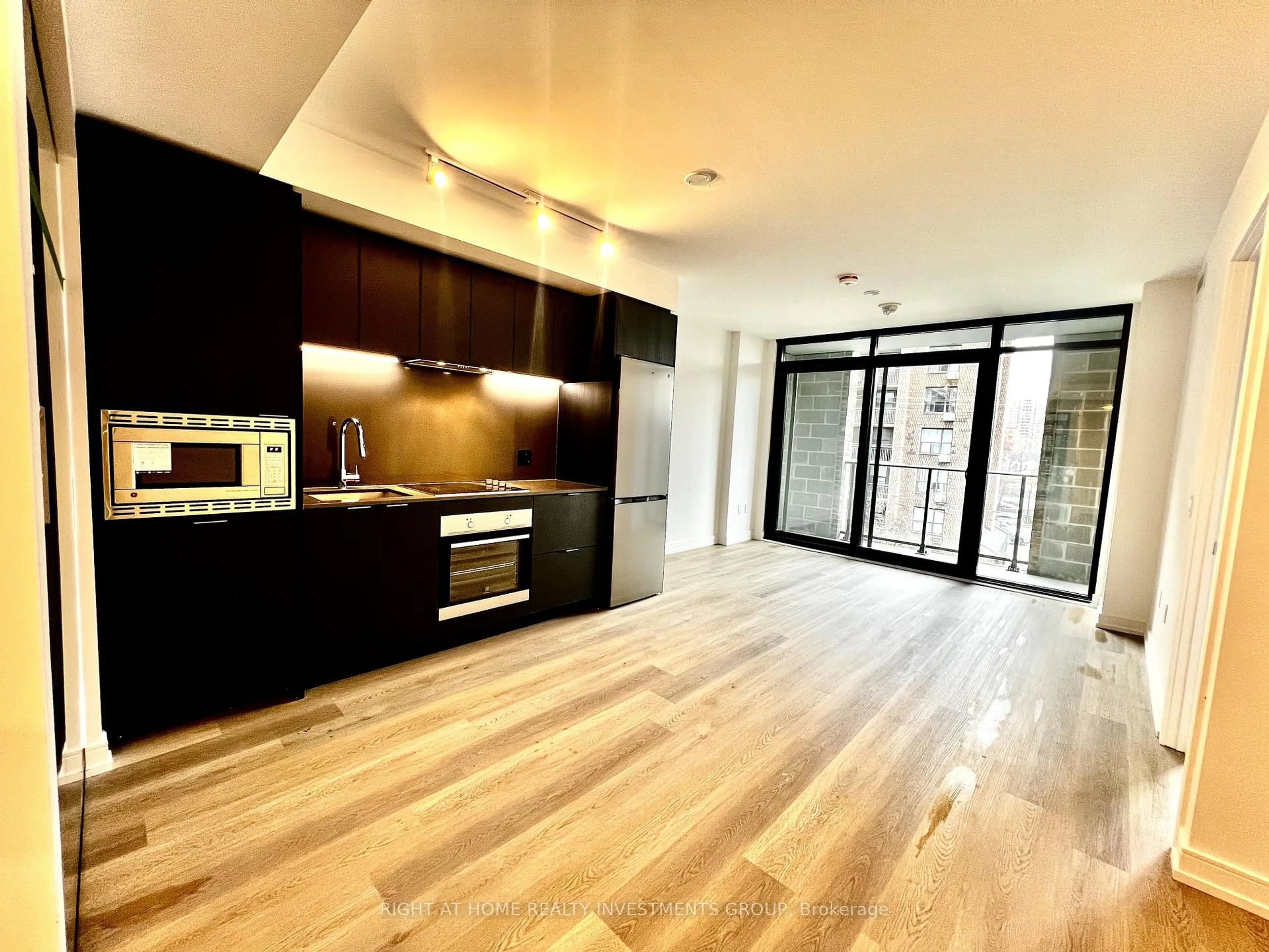 Open concept kitchen, wood/laminate floor for 1 Jarvis St #327, Hamilton Ontario L8R 3J2