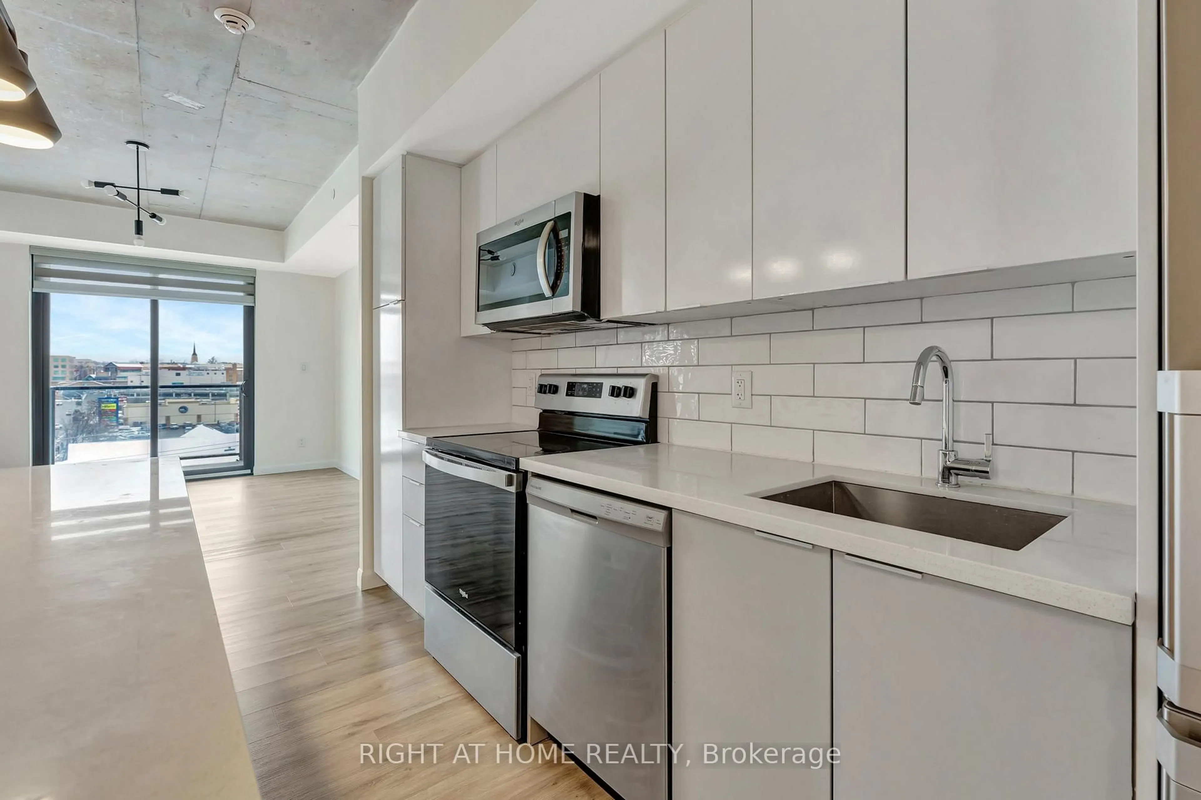 Kitchen with laundary machines, ceramic/tile floor for 7 Erie Ave #514, Brantford Ontario N3S 0K5