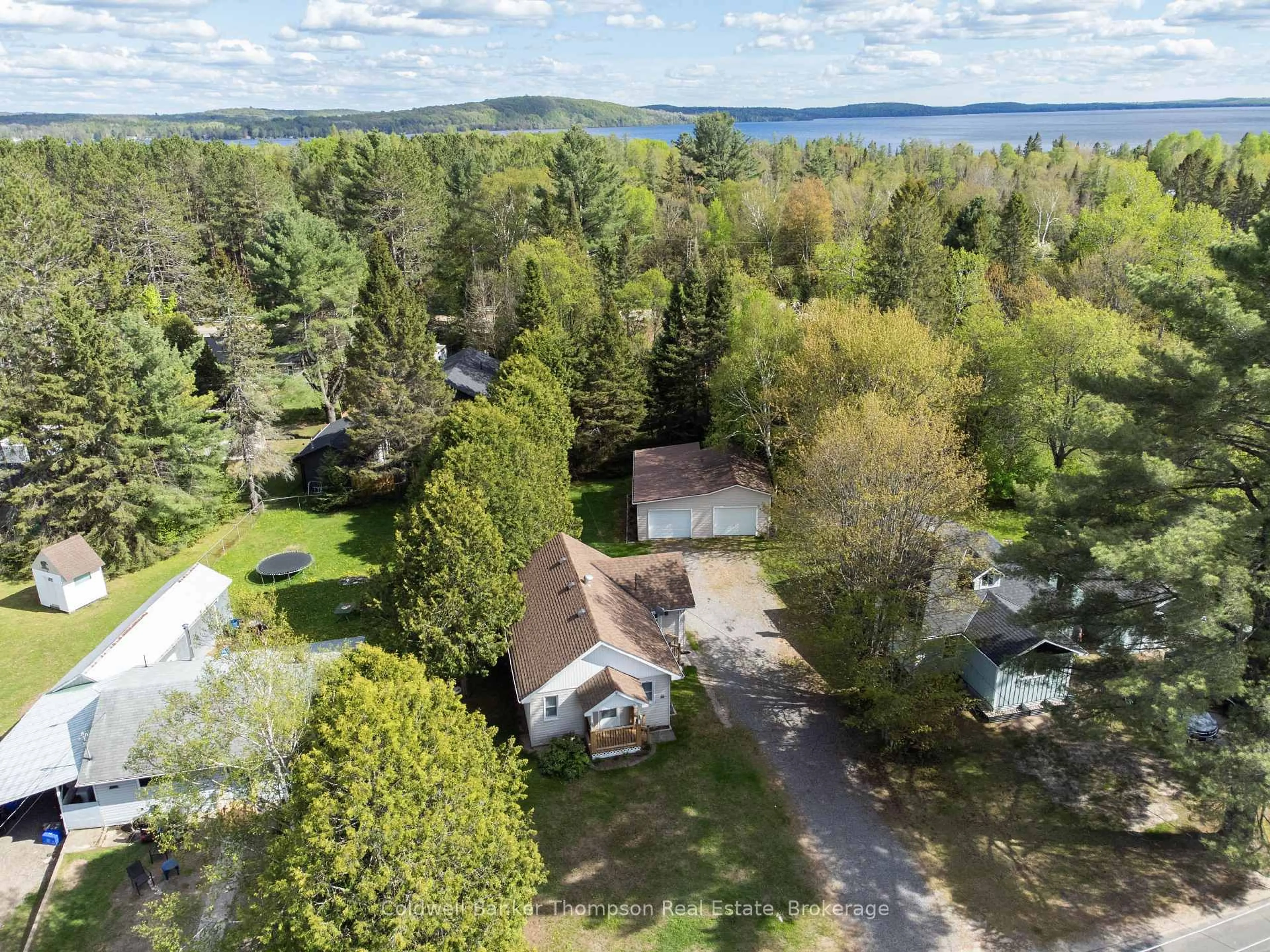 A pic from outside/outdoor area/front of a property/back of a property/a pic from drone, water/lake/river/ocean view for 71 Park St, Sundridge Ontario P0A 1Z0