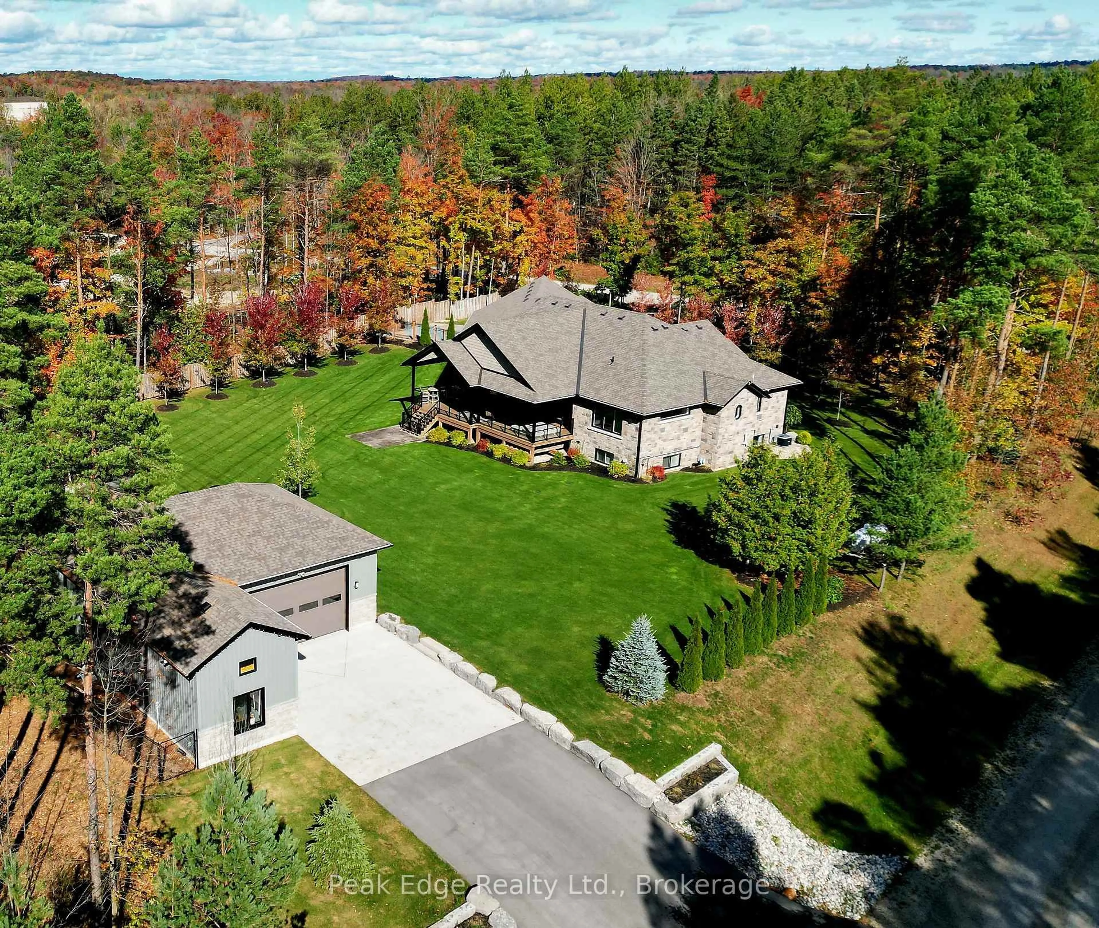 A pic from outside/outdoor area/front of a property/back of a property/a pic from drone, forest/trees view for 126 Forest Creek Tr, West Grey Ontario N0G 1S0