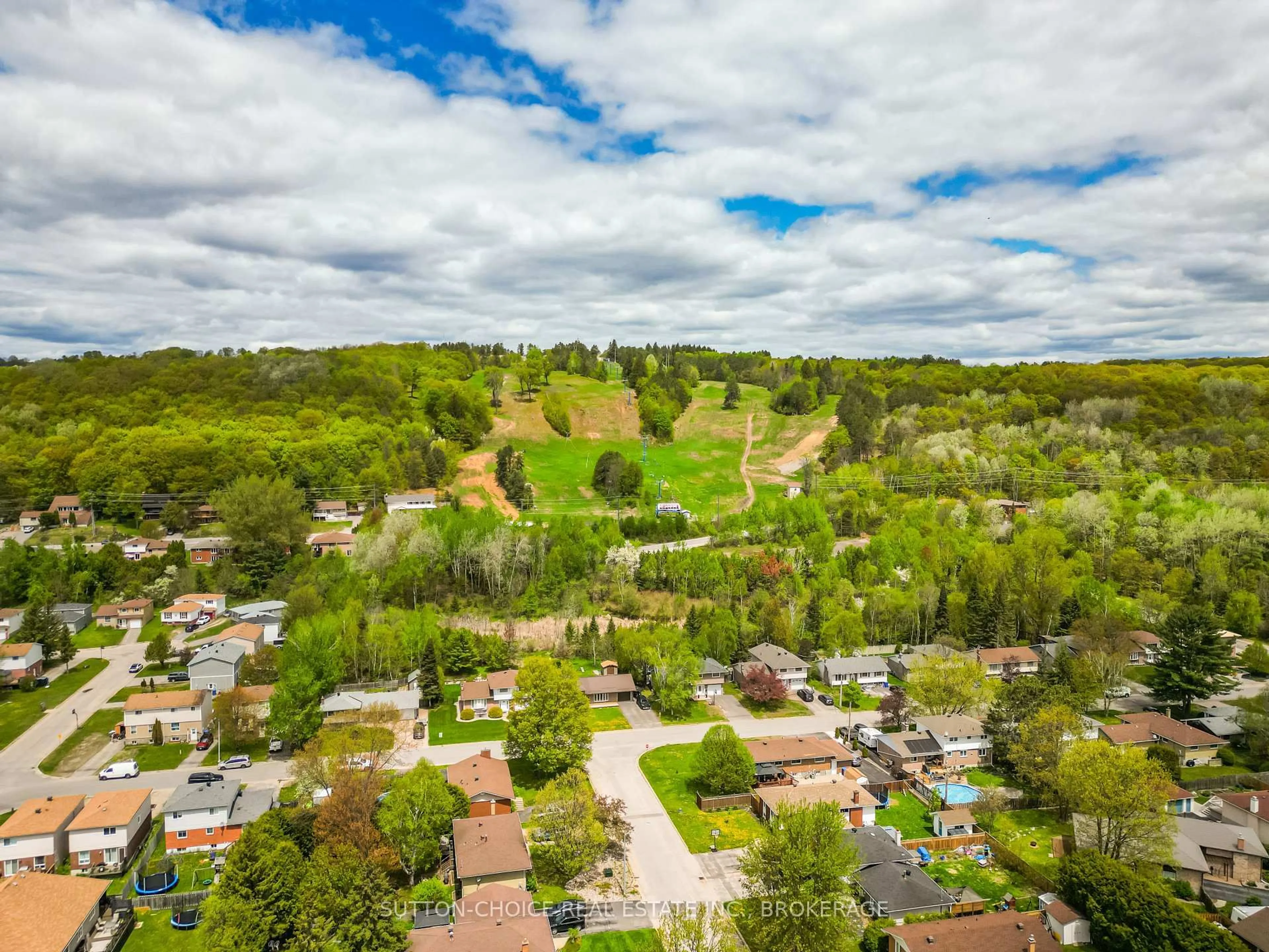 A pic from outside/outdoor area/front of a property/back of a property/a pic from drone, forest/trees view for 165 Macbeth Cres, North Bay Ontario P1B 7X7