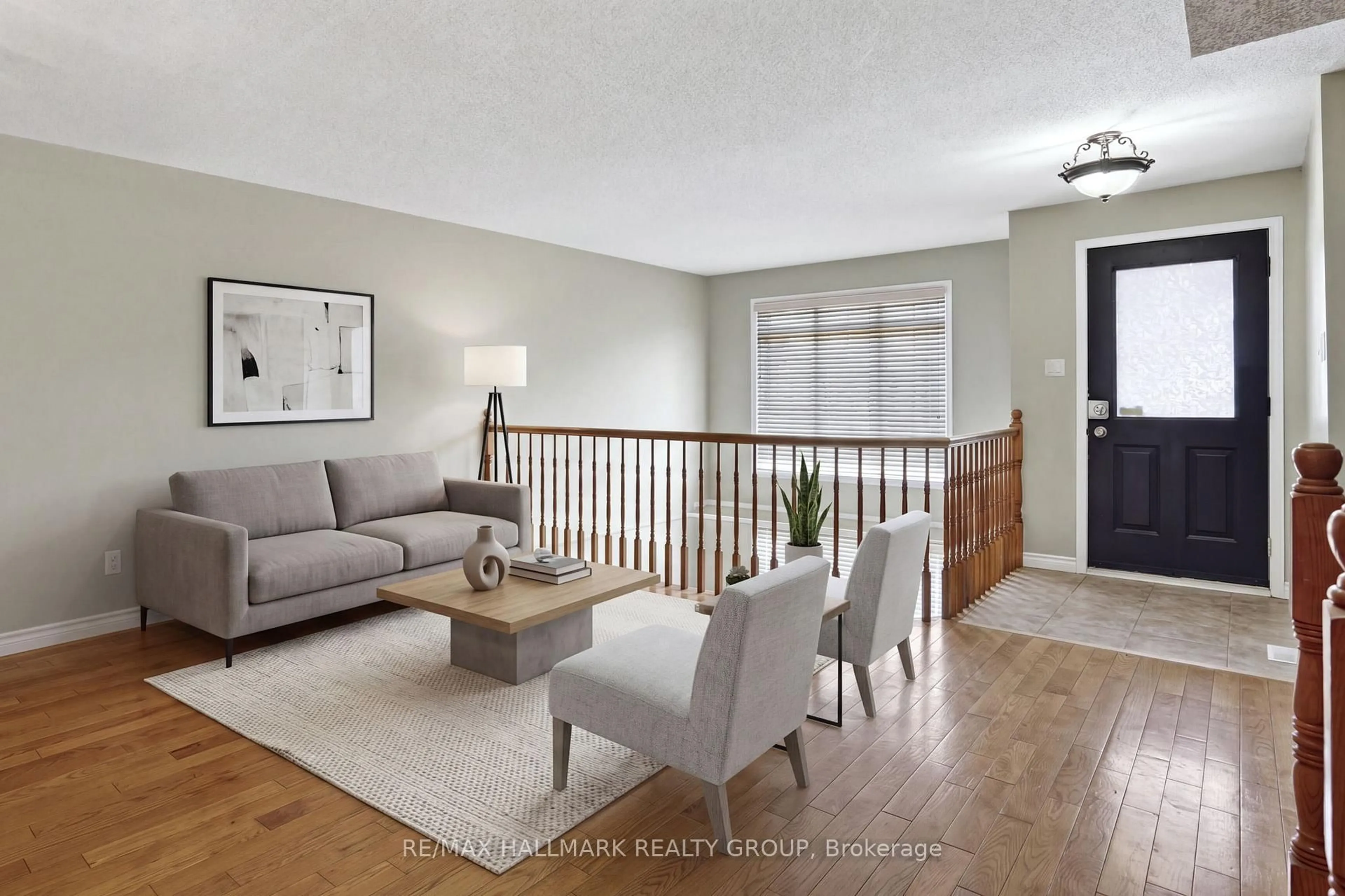 Living room with furniture, wood/laminate floor for 62 Briston Private, Ottawa Ontario K1G 5P5