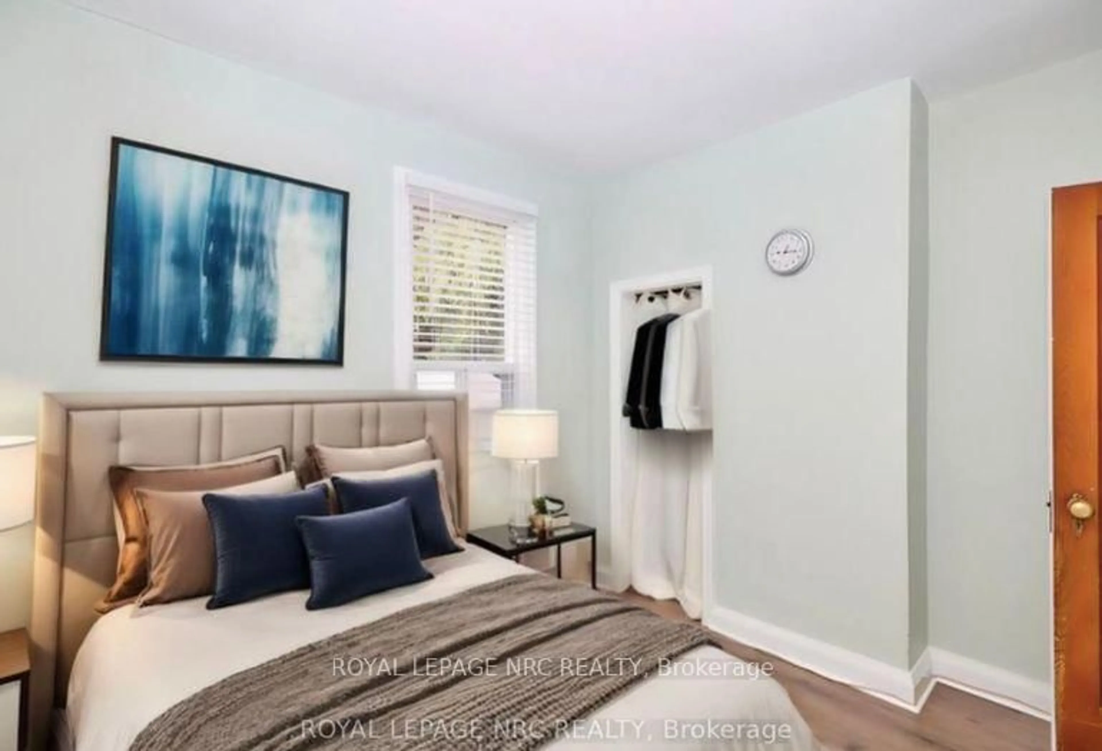 Bedroom with bed, wood/laminate floor for 223 Niagara St, St. Catharines Ontario L2M 4V3