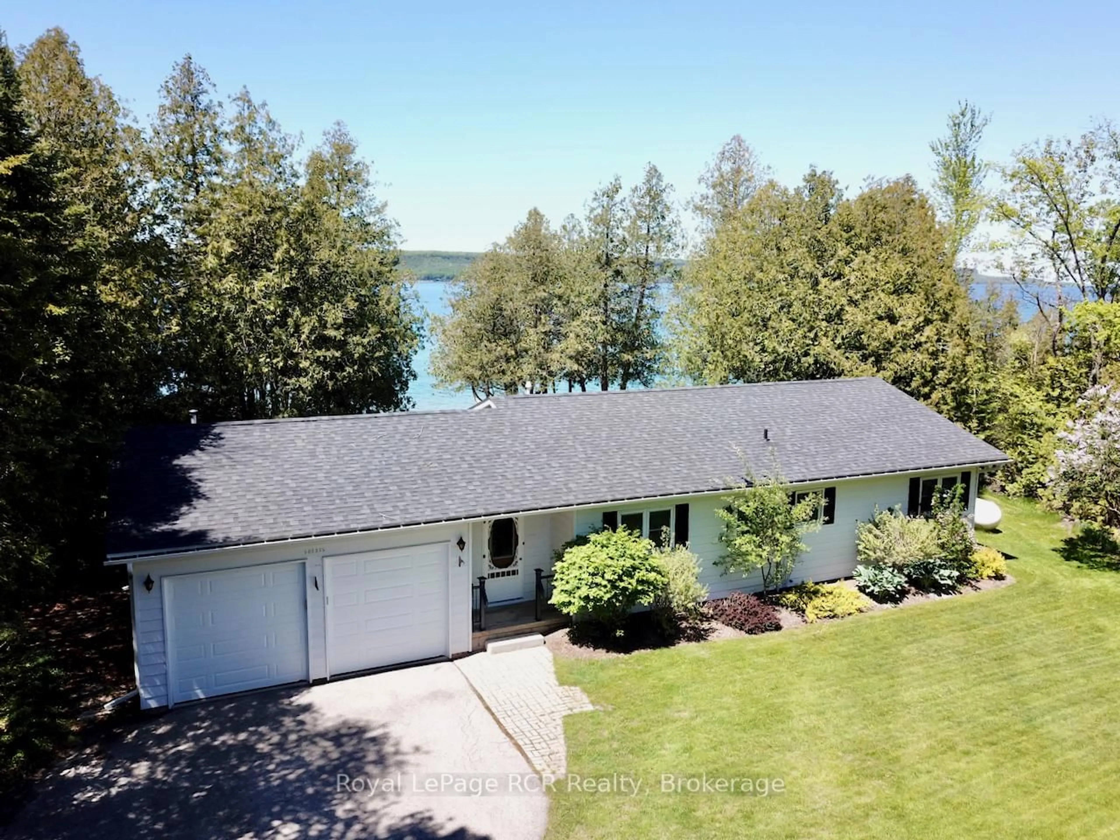 A pic from outside/outdoor area/front of a property/back of a property/a pic from drone, water/lake/river/ocean view for 502325 Grey Road 1 Rd, Georgian Bluffs Ontario N0H 2T0