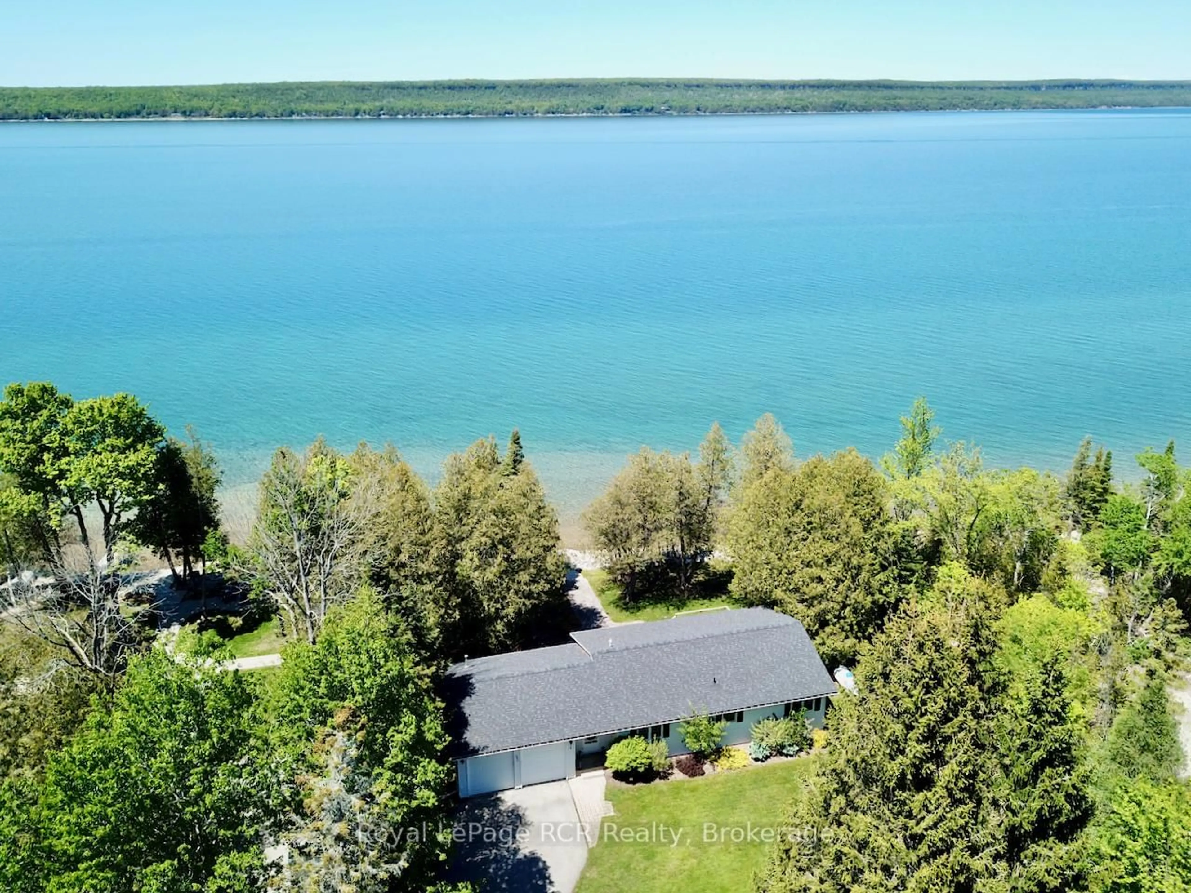 A pic from outside/outdoor area/front of a property/back of a property/a pic from drone, water/lake/river/ocean view for 502325 Grey Road 1 Rd, Georgian Bluffs Ontario N0H 2T0