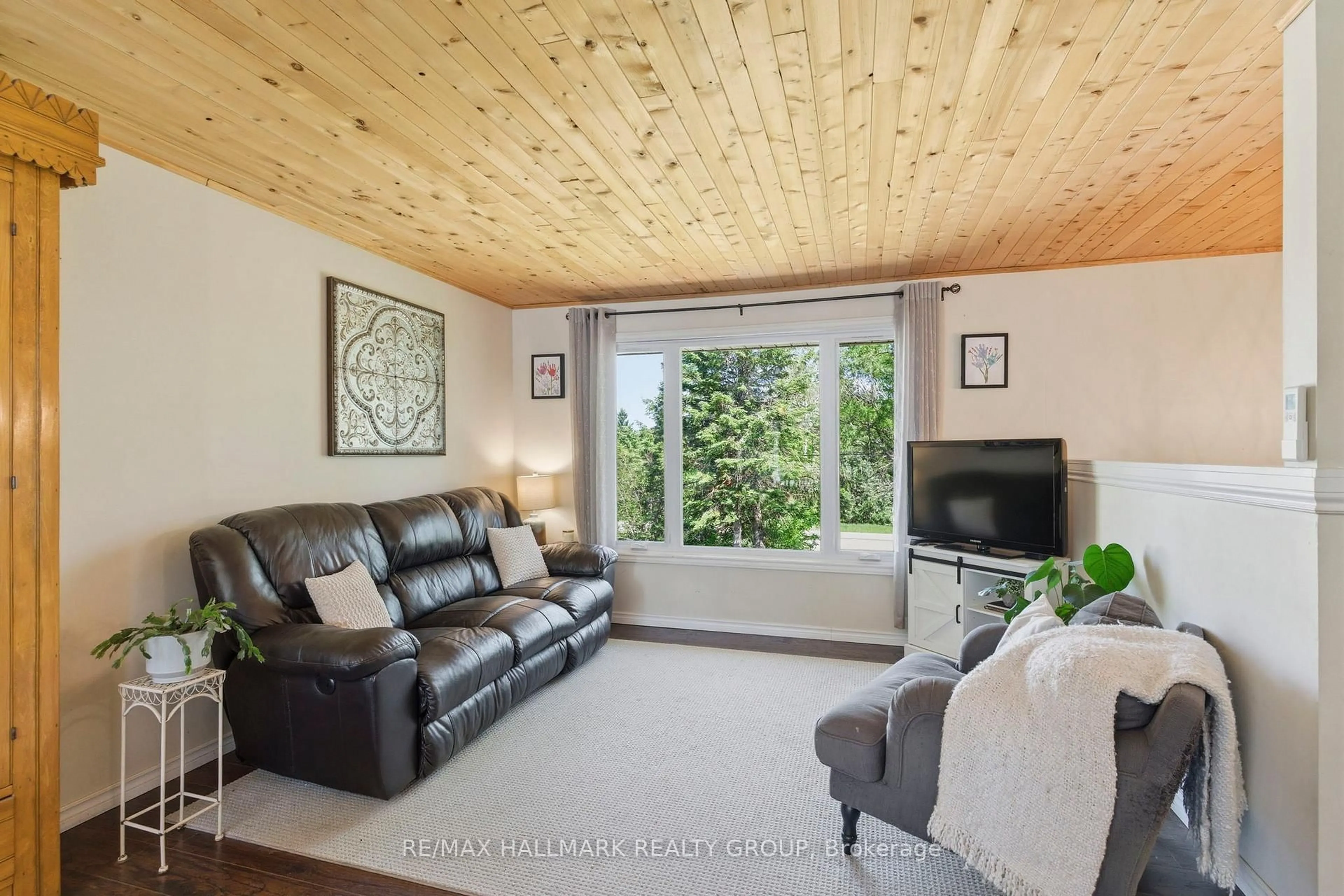 Living room with furniture, wood/laminate floor for 237 County Road 42 Rd, Leeds and the Thousand Islands Ontario K0E 1G0