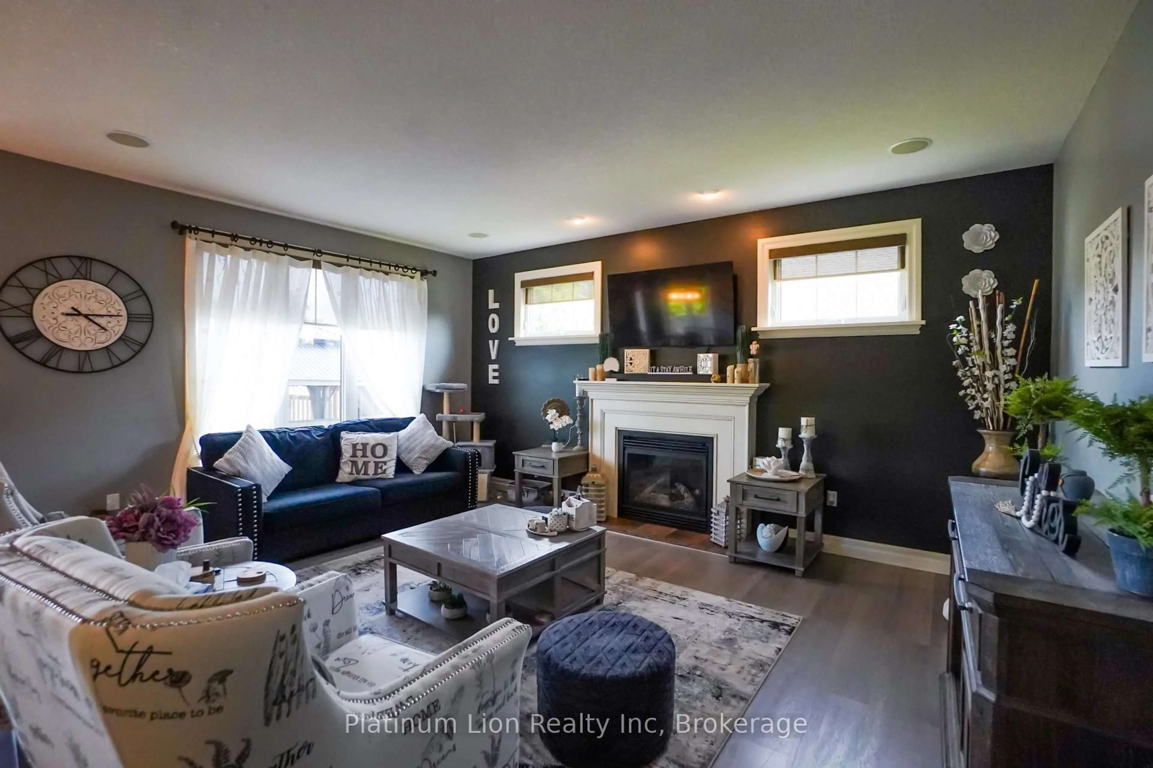 Living room with furniture, wood/laminate floor for 365 Poldon Dr, Norwich Ontario N0J 1P0