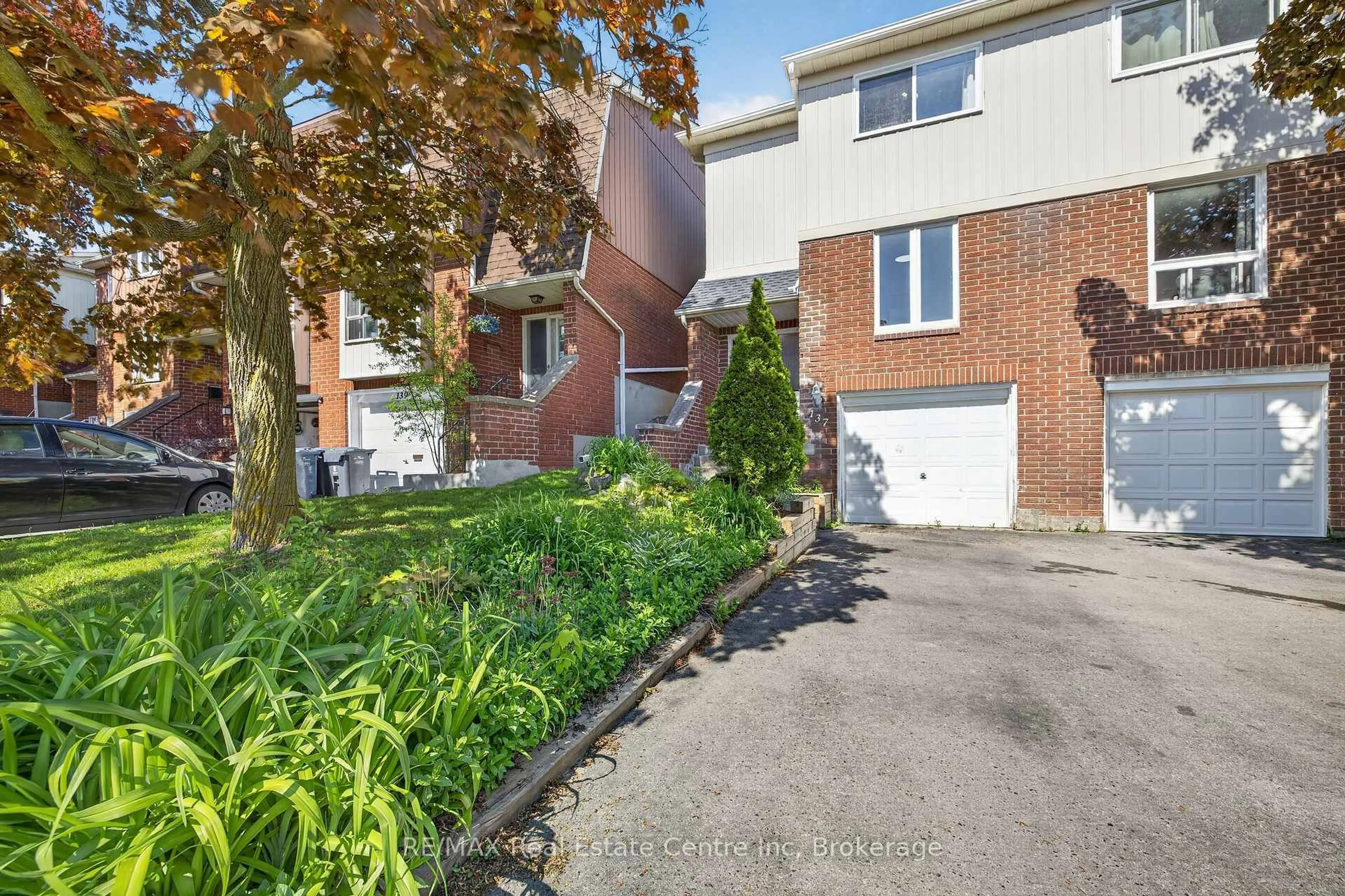 A pic from outside/outdoor area/front of a property/back of a property/a pic from drone, street for 137 Dovercliffe Rd #13, Guelph Ontario N1G 3A5
