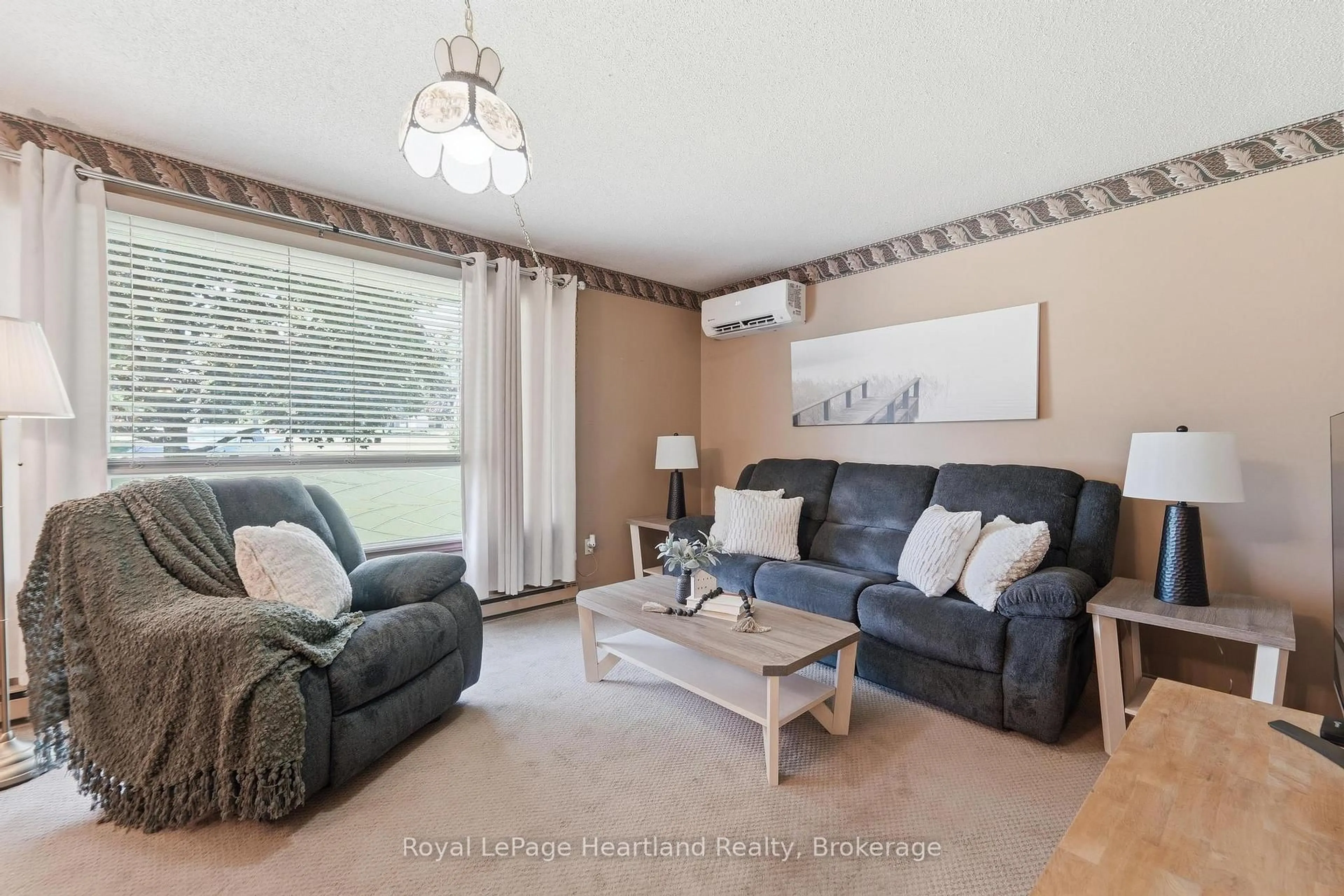 Living room with furniture, wood/laminate floor for 33 NORTH St, Huron East Ontario N0K 1G0