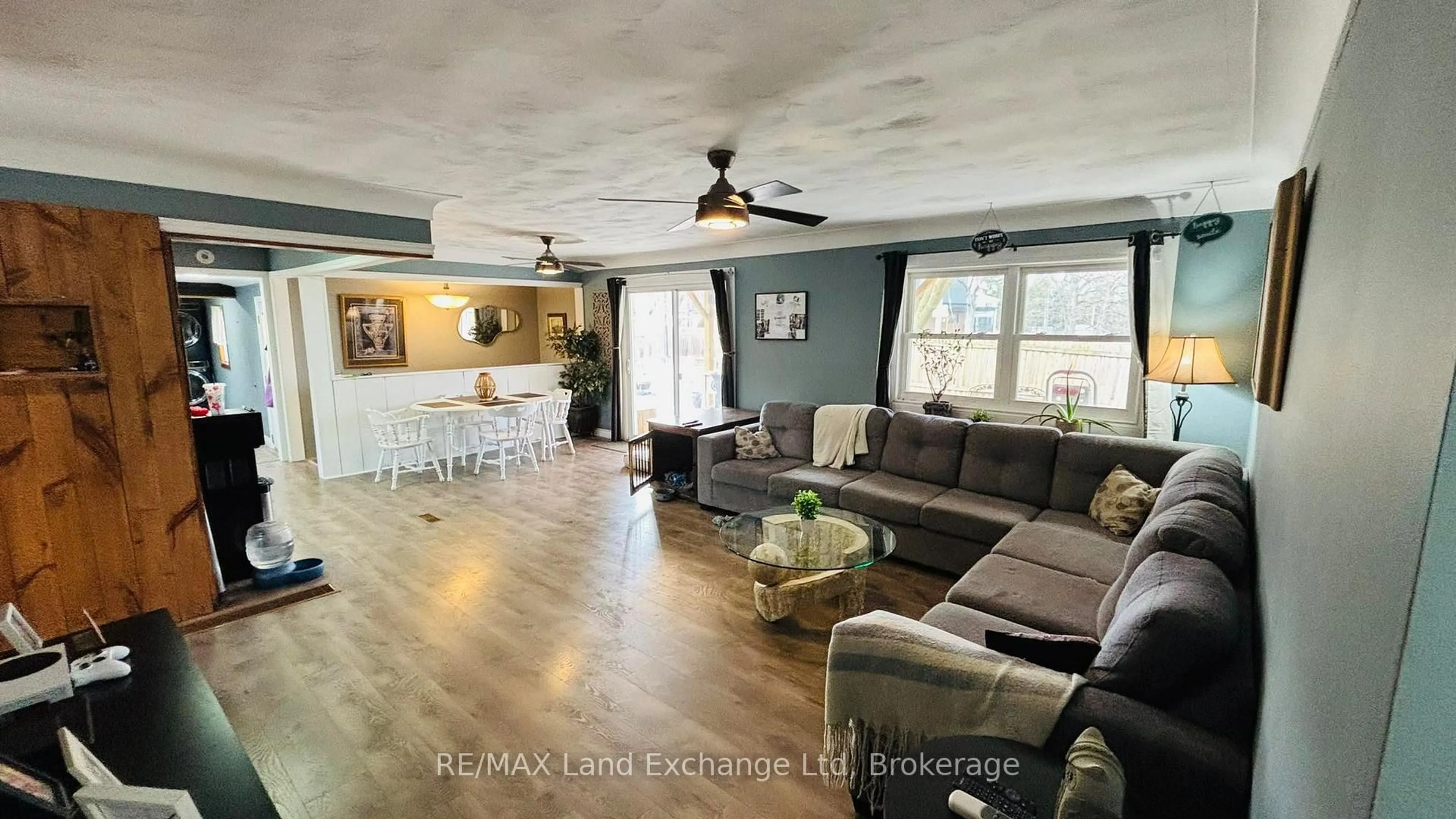 Living room with furniture, wood/laminate floor for 1041 Main St, Howick Ontario N0G 2X0