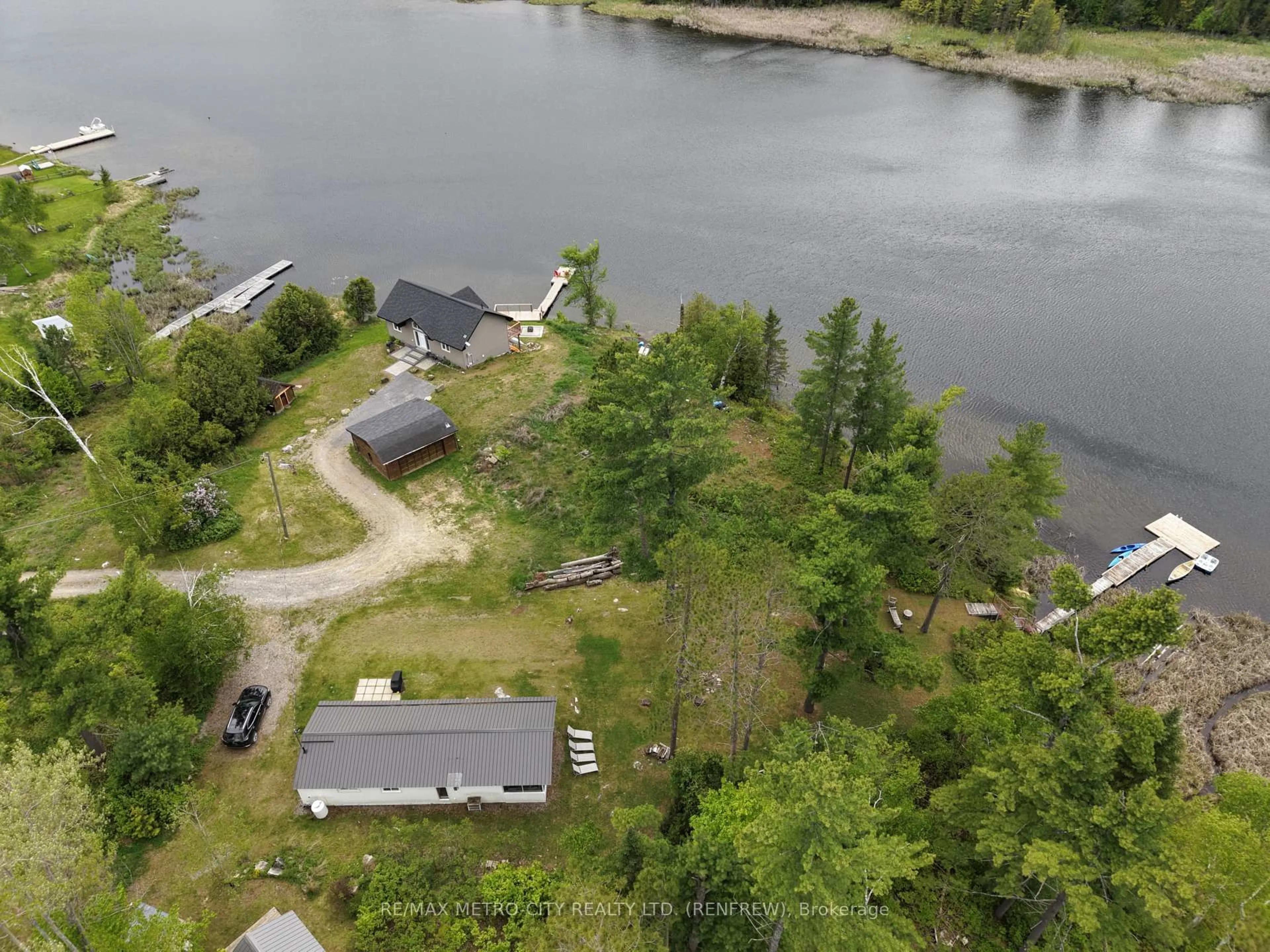 A pic from outside/outdoor area/front of a property/back of a property/a pic from drone, water/lake/river/ocean view for 982 STONES LAKE Rd, Calabogie Ontario K0J 1H0