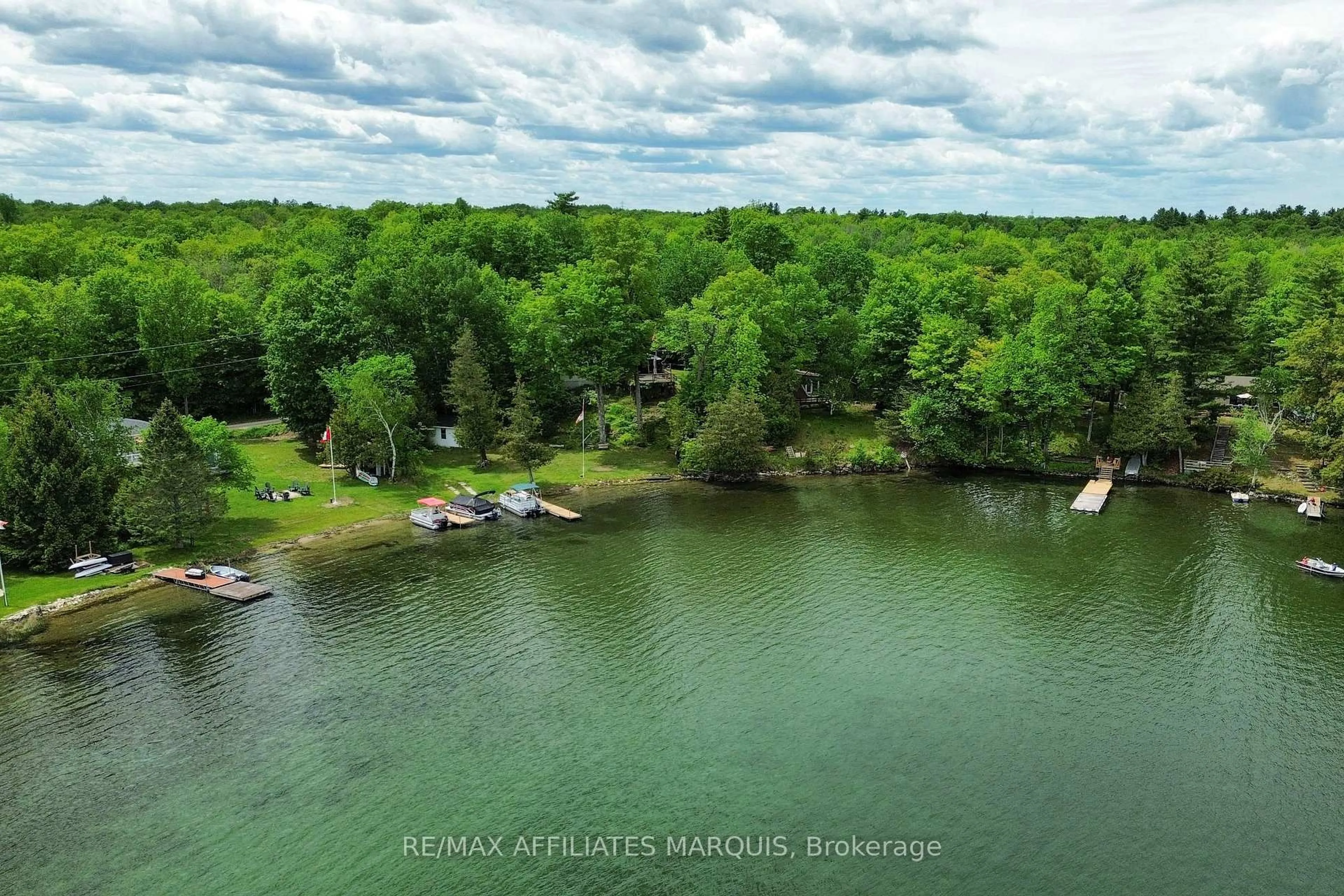 A pic from outside/outdoor area/front of a property/back of a property/a pic from drone, water/lake/river/ocean view for 91 West Shore Lane, Sharbot Lake Ontario K0H 2P0