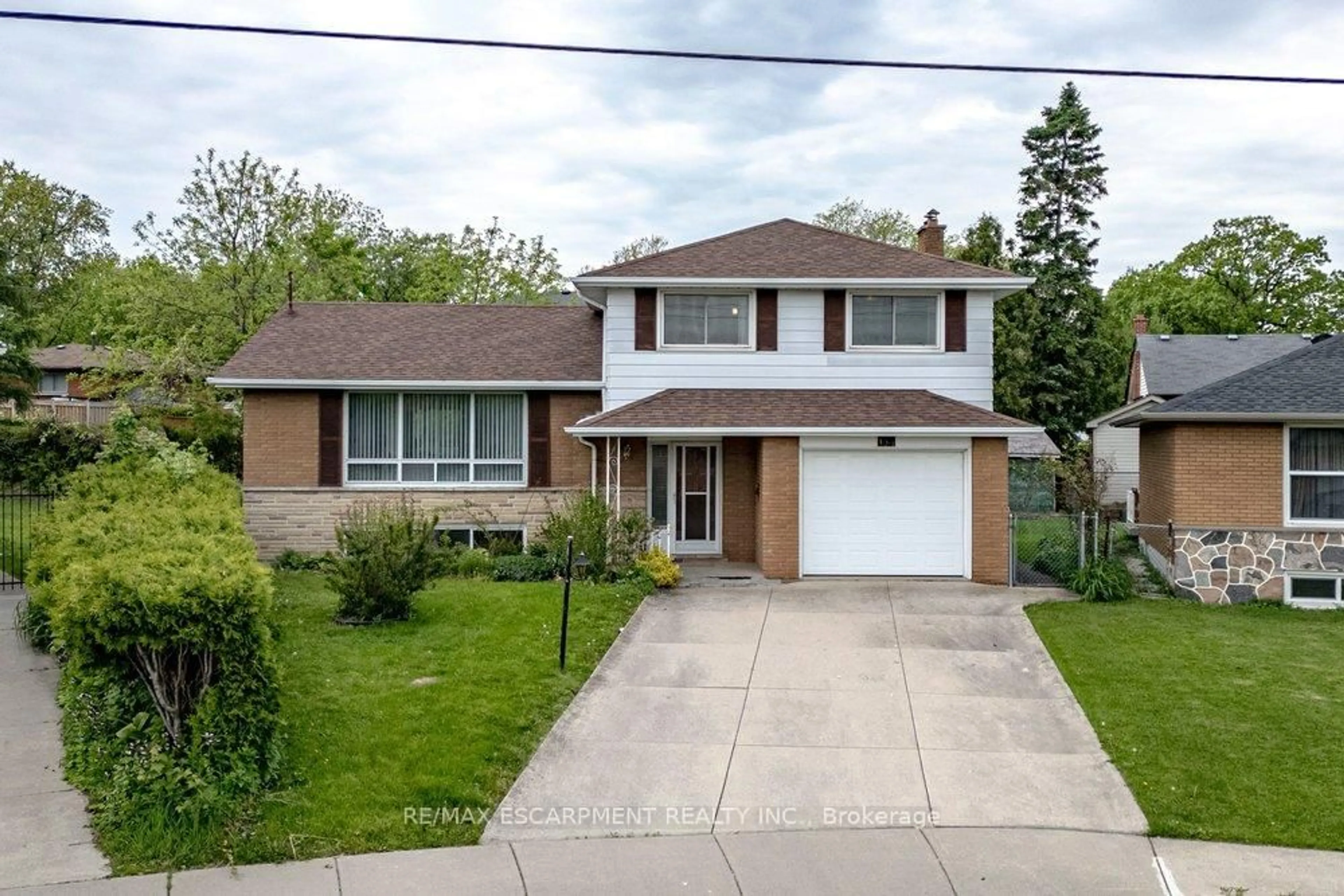 Home with brick exterior material, street for 134 Greeningdon Dr, Hamilton Ontario L9A 3A9