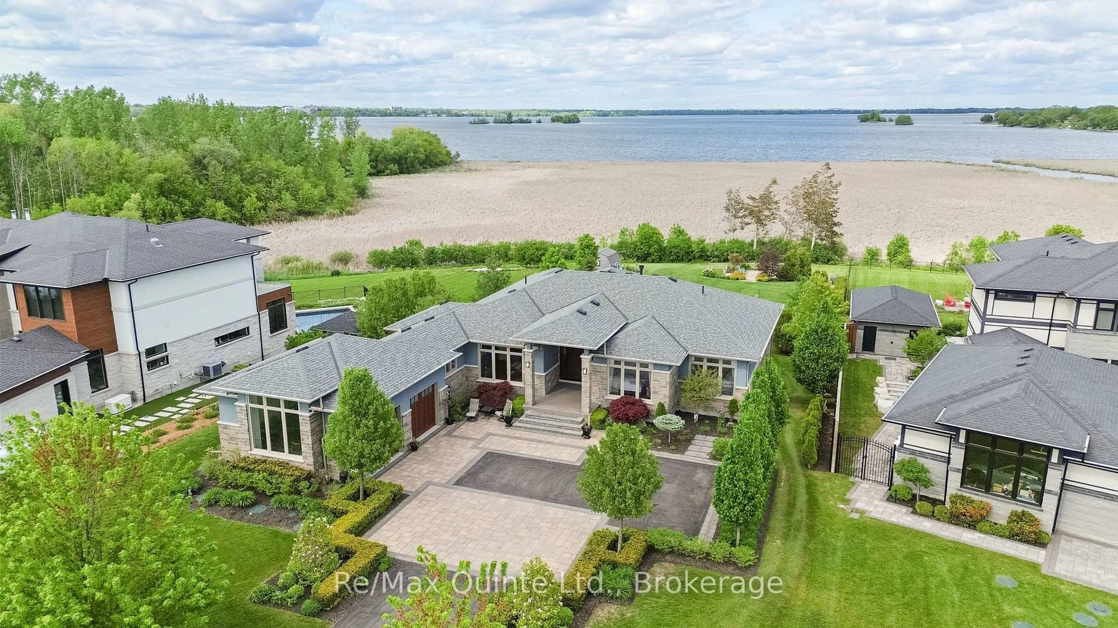 A pic from outside/outdoor area/front of a property/back of a property/a pic from drone, water/lake/river/ocean view for 89 Navigation Dr, Prince Edward County Ontario K8N 0G1