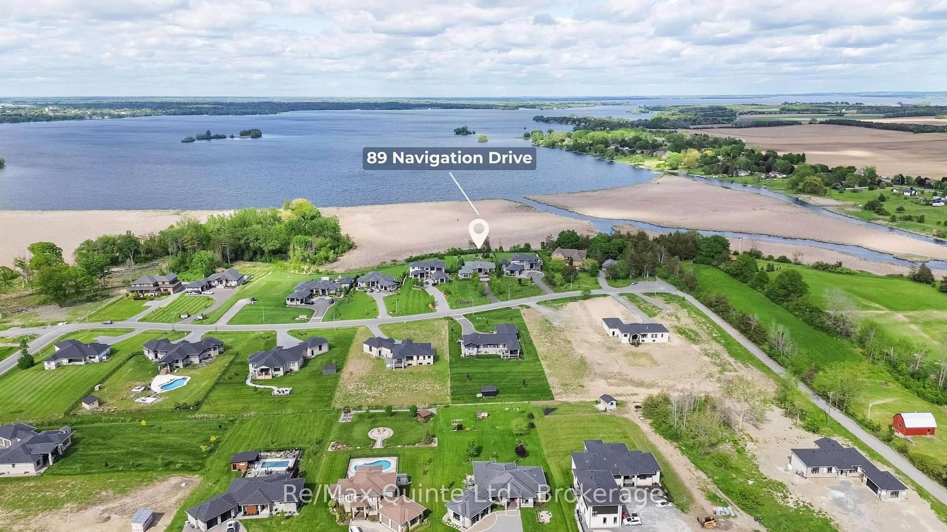 A pic from outside/outdoor area/front of a property/back of a property/a pic from drone, water/lake/river/ocean view for 89 Navigation Dr, Prince Edward County Ontario K8N 0G1
