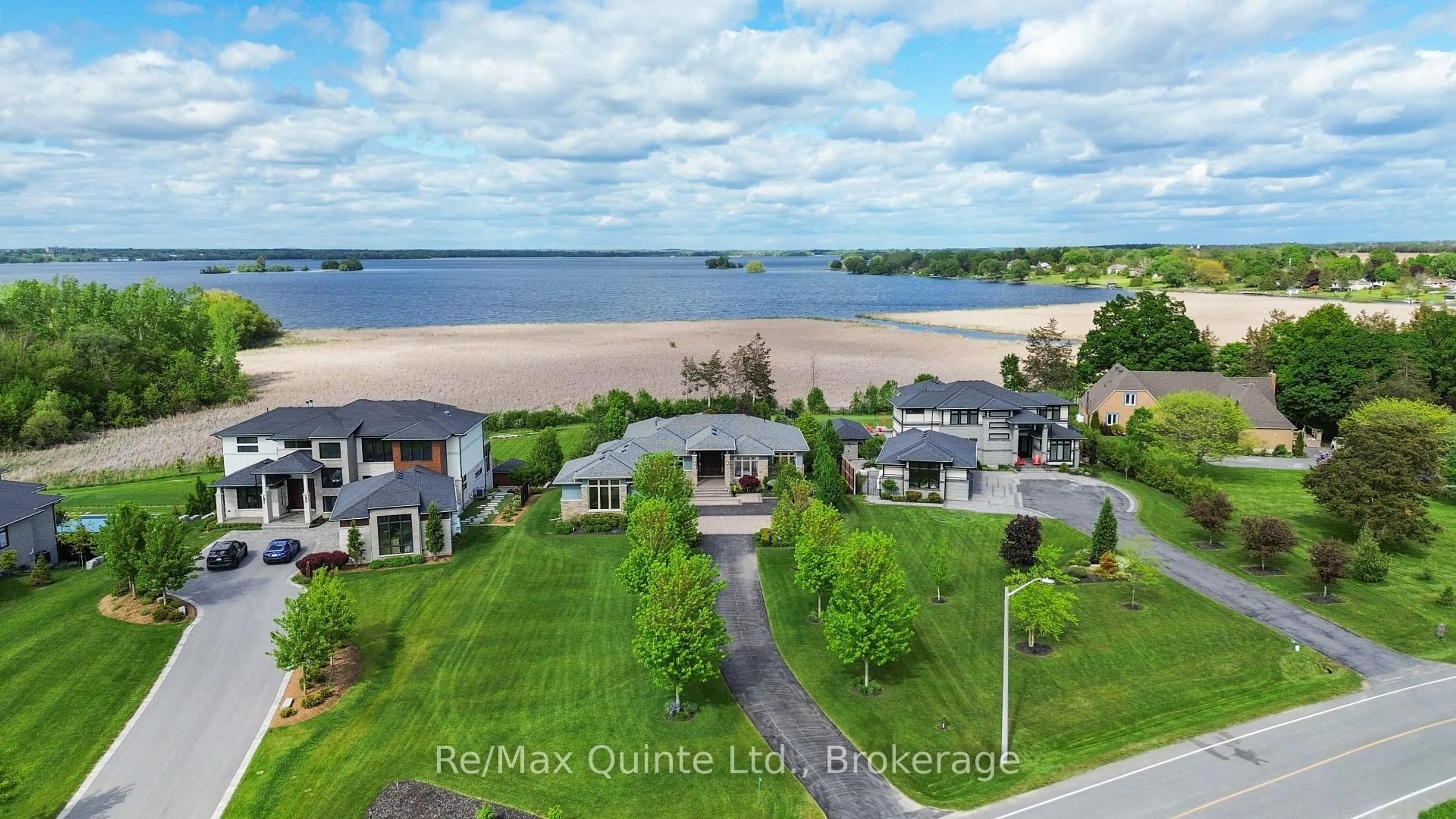A pic from outside/outdoor area/front of a property/back of a property/a pic from drone, water/lake/river/ocean view for 89 Navigation Dr, Prince Edward County Ontario K8N 0G1